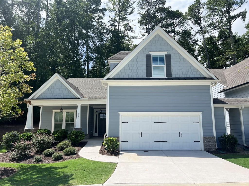 WON’T LAST LONG!! Corner lot, private patio, upscale finishes, a two-car garage, and great community amenities—this Woodstock gem has it all. Located in a vibrant new subdivision with a scenic pond, pool, and clubhouse, this home offers a bright open floor plan with 10-foot ceilings, hardwood floors, and retractable sliding doors for seamless indoor-outdoor living.
The chef’s kitchen features stainless steel appliances, a large island, and flows into the dining area with coffered ceilings. The main floor includes a luxurious primary suite with walk-in closet and curbless shower, plus a second bedroom and full bath. Upstairs, enjoy a spacious loft, third bedroom with en suite bath, and ample attic storage.
The corner lot location offers added privacy, while the private patio is perfect for relaxing or entertaining. The two-car garage provides plenty of parking and storage. Minutes from downtown Woodstock, Roswell, and I-575.