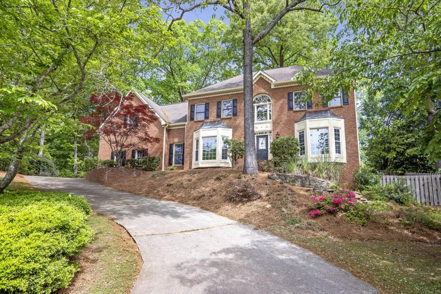 **Great Opportunity in East Cobb!**  Welcome to this quiet neighborhood, ideally located near shopping, dining, and top-rated schools. This is your chance to move to one of Atlanta's most desirable suburbs.  This traditional four-bedroom, three-and-a-half-bathroom home sits on a private lot and features a full, unfinished basement perfect for customization. The updated kitchen and bathrooms boast new stone countertops and flooring, while a new Trane A/C system ensures comfort year-round.  The spacious second-floor bonus room, accessible via a convenient back staircase, adds extra living space for your family. Enjoy the outdoors in this community, complete with a nearby lake for leisure activities.  The screened porch leads to a large, fenced-in backyard, perfect for kids and pets to play freely.  Highly regarded Pope, HighTower, and Tritt schools in the area are a major plus.  Don't miss out on this fantastic home schedule your showing today!