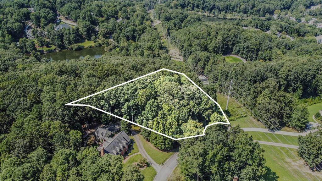 Exceptional Opportunity in Sandy Springs! Build your Dream Home on over 2 Acres in the highly sought-after Dunraven Place subdivision. Perfectly situated at the end of a Quiet Cul-de-Sac and surrounded by Beautiful, Well-Maintained Homes, this lot offers the ideal combination of Privacy and Community within a Developed Neighborhood. Zoned for Top-Rated Spalding Drive Elementary School and just minutes from the Chattahoochee River and Orkin Lake, this property sits in the heart of the Sandy Springs Park District. Enjoy endless outdoor activities with nearby Lost Corner Nature Preserve, Steel Canyon Golf Club, Abernathy Greenway, and Morgan Falls River Dog Park. This location is also ideally situated just minutes from I-285, Luxury Shopping at Perimeter Mall, the Sandy Springs Farmers Market, and all the fun at City Springs Center featuring Interactive Fountains for kids, Delicious Dining Options, and the Performing Arts Center. Offering Unmatched Convenience, this is truly a Rare Find an expansive lot in a prime location with endless potential. Don't miss your chance to own in the Vibrant Heart of Sandy Springs and create something extraordinary!