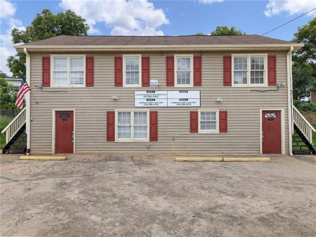 Commercial Office Space in Downtown Buford, just one street south of Main Street. Located Behind the Buford Grill and steps away from Rico's World Kitchen; catty Conner to Main Street Blooms. Free standing multi-unit building with its own parking lot. Building consist of 4 units, each unit has independent entrances, electric meter and HVAC. The downstairs units A & D have been combined and used as a single unit, but could easily be closed/converted and used as two separate units. Two units are leased; Unit C is leased to Used Auto Broker, Unit B is leased to a Renovations Company. City of Buford has approved the construction of a side walk on West Moreno Street. Please consult with the City of Buford for more details on this project. Lots going on in this street, Moreno Street has a new 256 space parking deck, Meander Brewing on West Moreno -soon to open will be a great hangout spot, additionally on Moreno Street is Tchin Tchin Coffee.