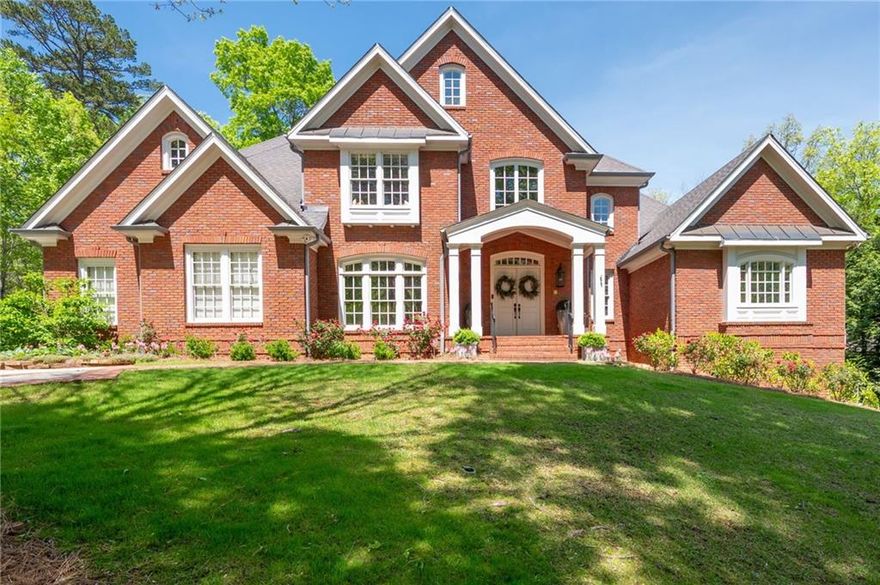 Your dream home awaits you! Luxurious 4 sided brick custom home built by Elliott Homes in sought after beautiful community of Oak Grove. Home is situated on over an acre private, cul-de-sac lot with exquisite landscaping to include several gorgeous Japanese Maples. Step into the grand 2-story foyer with lots of natural light and sets the tone for the rest of the home combining luxury with a warm welcoming ambiance. The Dining Room is perfect for gathering with family and friends for special dinners. Walk into the beautiful Great Room with cathedral ceilings, custom built-ins, fireplace and opens onto large deck overlooking park-like backyard that would be perfect for a pool! The Kitchen is a chef's dream designed for both functionality and elegance to include stainless appliances, granite counters, double ovens, gas cooktop and separate breakfast area, open to beautiful 2-story Keeping Room with stack stone fireplace, perfect for your morning coffee. Luxurious Primary Suite is on main level, a serene retreat designed for comfort and relaxation. This spacious bedroom features large private sitting area with built-in cabinets-perfect place to unwind with a book or glass of wine. Access to back deck from sitting room. Oversized Spa-like Bath features trey ceiling, separate shower and tub with his/her vanities and closets. The upstairs includes 3 large en-suite Bedrooms each offering comfort and privacy. There is also a Loft-perfect for a study, sitting area or playroom. There are two hidden rooms that the kids will be sure to love. The Terrace Level is perfect for an In-law suite featuring a spacious Living Room, Game Room, Spectacular Theater, and wet bar that can be used as a mini Kitchen, plus a Full Bath and Bedroom! Fabulous location convenient to Kennesaw National Park with miles of hiking trails, Marietta Country Club, Mount Paran Christian School, Kennestone Hospital, The Marietta Square with great restaurants, shopping, and more. Don't miss the opportunity to see this beautiful home!