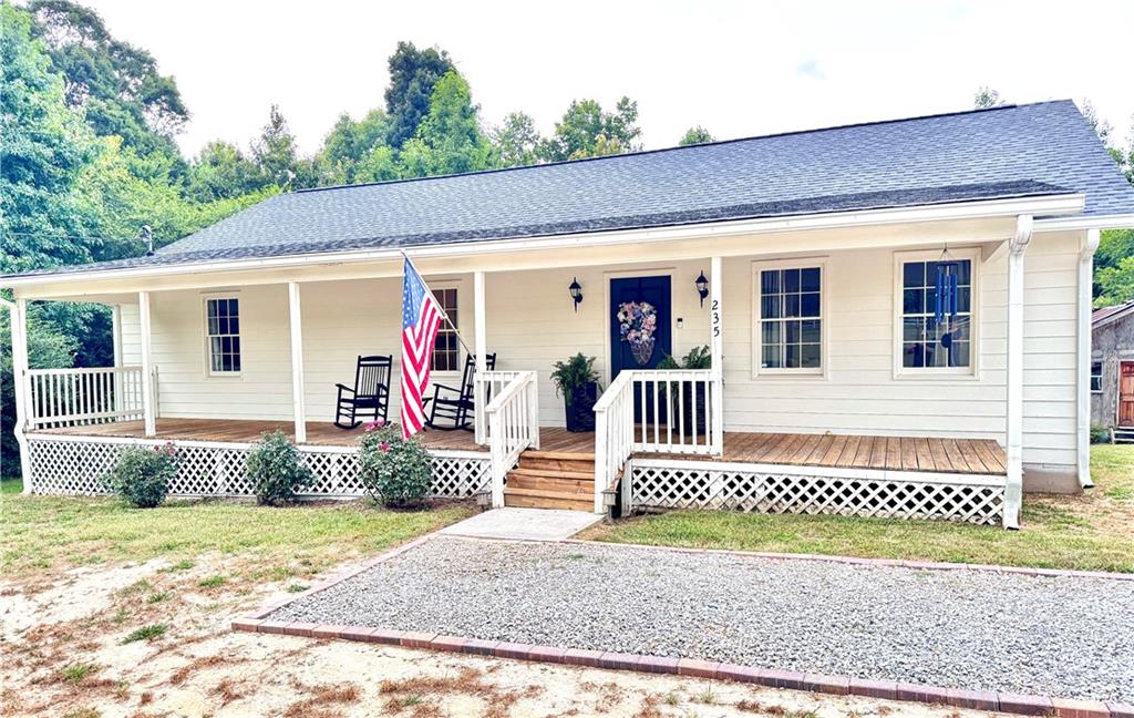 Charming Renovated Farmhouse on Over 2 Acres - No HOA! Escape the hustle and enjoy peaceful country living in this beautifully renovated farmhouse, set on more than two acres of flat, usable land with no HOA restrictions. This private retreat offers 3 generous bedrooms and 2 full bathrooms, thoughtfully updated just a couple of years ago with stylish flooring, fresh paint, and modern lighting throughout. Relax and unwind on the expansive front porch, the perfect spot for rocking chairs and summer afternoons. Step inside to an open-concept living area filled with natural light and timeless finishes. The kitchen shines with stainless steel appliances, granite countertops, and a subway tile backsplash, all installed during the renovation and still in great condition. The home also includes a relatively new HVAC system, offering peace of mind and year-round comfort. Whether you're looking for space, serenity, or a place to garden, build, or simply breathe, this move-in-ready farmhouse checks all the boxes. Schedule your private tour today - properties like this don't last long! Schedule your showing SOON!!!