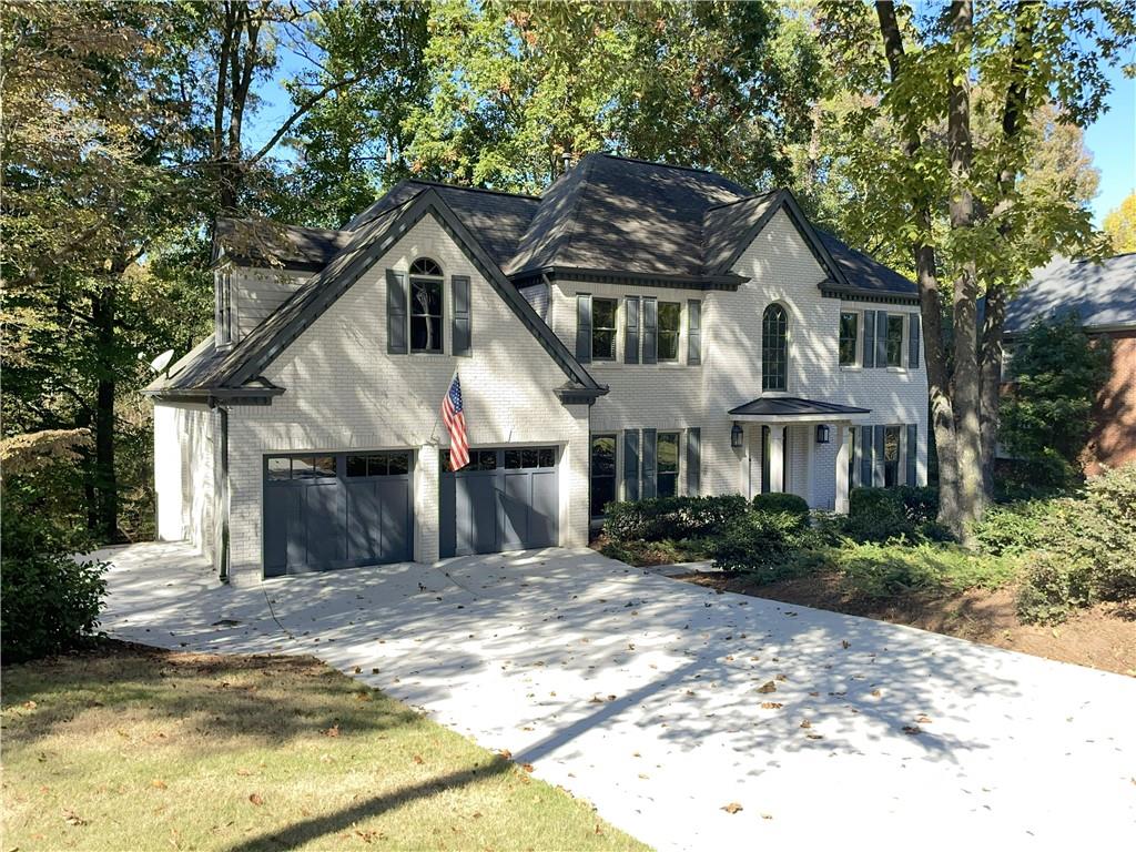 Opportunity knocks in popular Hampton Woods Swim / Tennis community.   This four bedroom home with a finished basement sits on a half acre lot with enough room to create your own athletic field!  Portico entry, two story foyer with architectural window.  Formal dining room and separate living room that is ideal for a home office.  Family room with brick fireplace, wet bar and a wall of glass overlooking the deck and incredible backyard. Updated kitchen with high end cabinetry, quartz countertops and stainless appliances.   Bright and airy breakfast room is adjacent to full laundry and back stairs.  Access the oversized composite deck with aluminum railings from either the breakfast room or den.  Primary suite with trey ceiling, walk in closet and gorgeous luxury bathroom with high end cabinetry, fixtures, and finishes.  Three additional bedrooms up including one en-suite and two with a double vanity, shared bath.  The heated and cooled terrace level is 90% finished and with multiple areas creating the opportunity for independent hangout, studio, office and/or storage space.  The square footage and footprint would also allow for a high end open concept destination for the entire family.