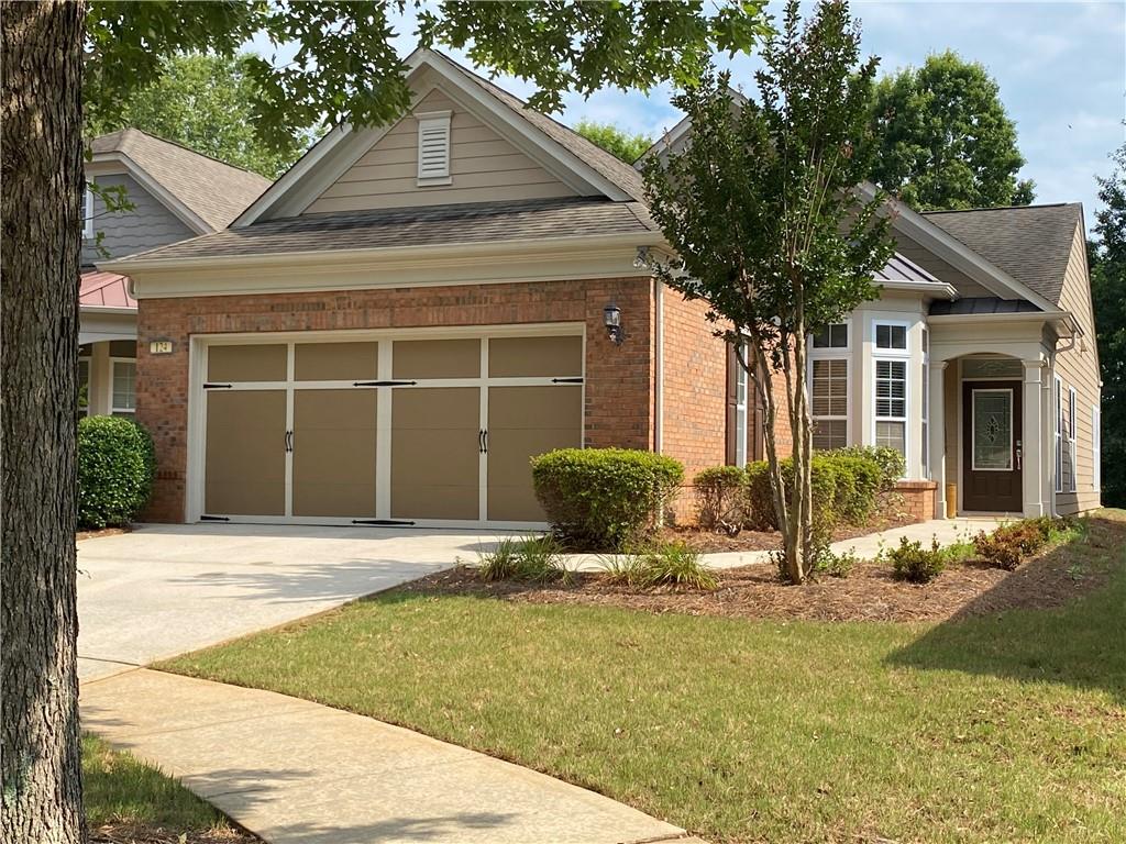 Located on a cul-de-sac and overlooking trees. This 3 BR 2 BA home has been waiting for you to start your new active lifestyle. All Luxury Vinyl Floors!! Close to Clubhouse, pool, and athletic field. You will enjoy the 45,000 sq ft Clubhouse offering Fitness Center with an indoor track, indoor and outdoor pools and so much more! There are over 50 different Clubs available for you to join you'll never be at a loss for what to do! Immediate occupancy!! Home is in a 55+ community. This community is one of Pulte's largest and most beautiful Active Adult communities in Georgia. For an additional fee join SCP Golf Club and enjoy the Restaurant and Golfing.