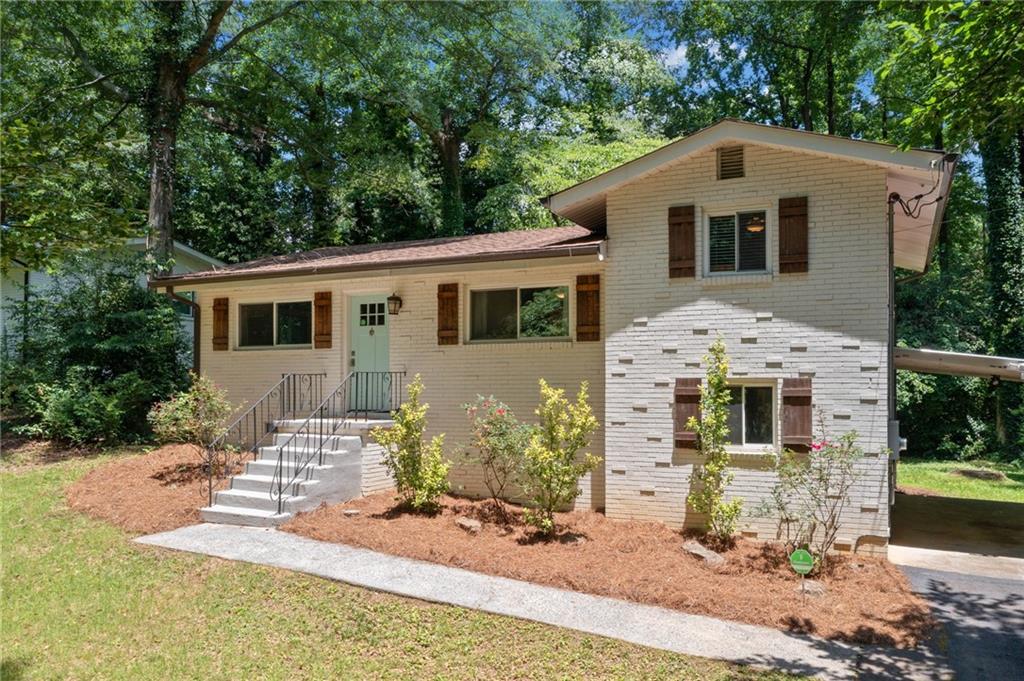 This stunning four-sided brick home underwent a complete renovation in 2017, including a reconfiguration of the floorplan on the main level to enhance its open and inviting layout. All the major updates have been completed, including new plumbing, roof replacement, a new electrical panel, an updated meter, and a brand-new line from the street to the house. Inside, you’ll find warm hardwood flooring throughout, creating a cohesive flow and adding timeless charm. The updated kitchen is a chef’s delight, featuring stainless steel appliances, elegant stone countertops, and abundant cabinet space. All the bathrooms have been tastefully remodeled to reflect modern design and functionality. Step outside to enjoy the private backyard, providing a perfect space for outdoor activities. The property also features a convenient carport for parking. Located near I-75, this home offers easy access to interstate travel and nearby amenities. Move-in ready, this property combines modern comfort with classic appeal. Don’t miss your chance to call this exceptional home your own!