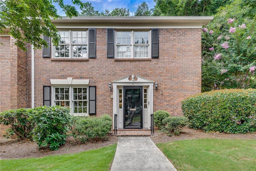 Welcome to this stunning end unit townhome situated in the heart of vibrant Dunwoody! Natural light floods this home through walls of windows, newer french doors and bay window. The conveniently located bedroom and full bath, gorgeous fireside den, two sets of french doors to a relaxing brick courtyard, white kitchen, and a large dining area with expanse to entertain add practicality and elegance to the main level! Smooth 9 foot ceilings and generous crown and baseboard molding add sophistication. The huge, serene primary suite boasts a second fireplace and a designated flex space with doors, perfect for a nursery, office, sitting area, or exercise room. The additional secondary bedroom is located on the upper level and utilizes a renovated hall bath with double vanity. Enjoy the outdoors in the stately and private brick courtyard accessed from dining or living areas. New lighting, ceiling fans, HVAC ductwork, and attic insulation make this home as sound as it is lovely! Dont miss the opportunity for modern, low-maintenance living across from Dunwoody Country Club! Convenient to schools, Dunwoody Village, and places of worship; walkable on sidewalks to shopping and dining.