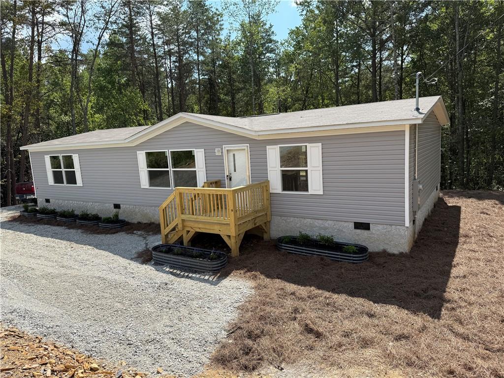 Brand new 3 bedroom, 2 bath home on 2 acre in Ranger. The living area is generous with an open floor plan. The kitchen features an island with a separate dining area. The master bedroom is roomy with it's own private bath and walk in closet. Two bedrooms on the other side of the house each include a walk in closet. Perfect location for anyone looking for mountain living while being 20 minutes from town. Home is on a permanent foundation and will qualify for financing.