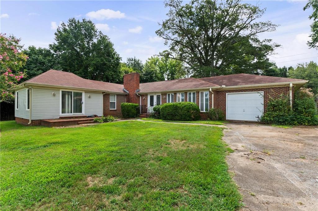 PRICE ADJUSTMENT + GREAT LOCATION & POTENTIAL COMMERCIAL! Brick Home that would make a great Office Space for any business, Florist, Personal Care home, Day Care! Ready for you to have Zoned for your business! Large Spacious Great Room w/fireplace, Formal Dining Room, 3 Bedrooms and 2 Full Baths! Oversized 1 car garage, Fenced back yard plus storage building! Home is on Sewer & county water plus there is a well available too! HVAC only appx 3 years old & Brand-New water heater! Only Minutes into Griffin, close to Shopping, Hospital & Restaurant's! Don't miss this Great Property and the Opportunity for you to make this your own! **Special Financing Options Available**