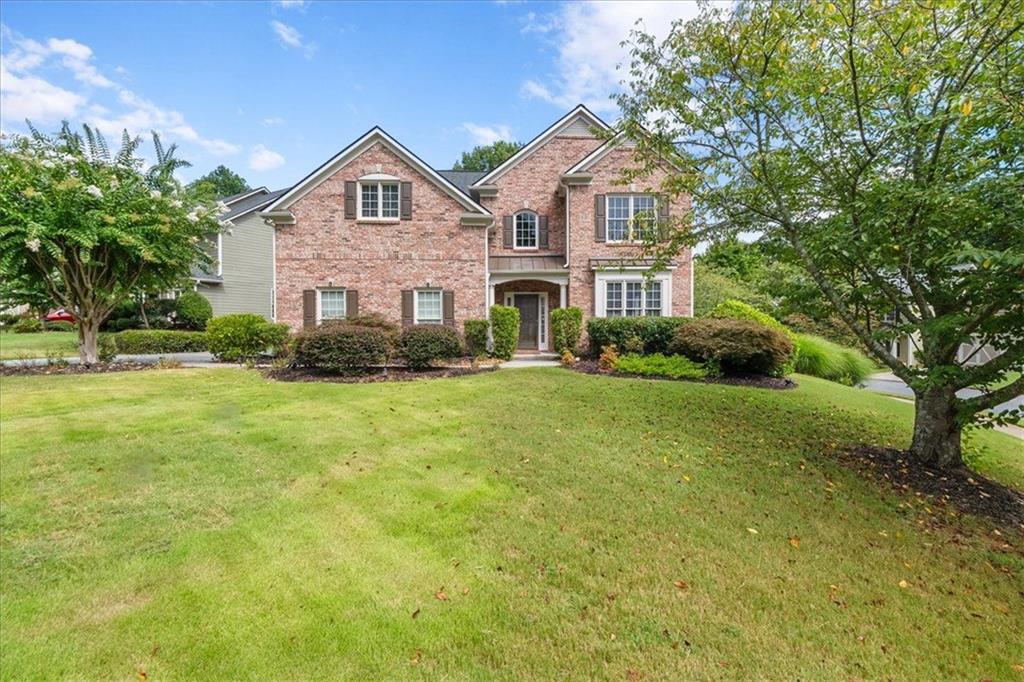 Welcome Home to Comfort, Charm, and Convenience! This beautifully maintained, one-owner home offers timeless elegance and modern comfort in an established Cobb County community. From the moment you enter the double-story foyer, you’ll feel the pride of ownership throughout. The main floor features a formal living room and dining room with chair rail accents. It’s perfect for entertaining. The spacious family room boasts a cozy fireplace and dramatic two-story windows that flood the space with natural light. The open concept kitchen overlooks the family room, creating the perfect gathering space. A bedroom and full bath on the main level offer flexibility for guests, in-laws, or a home office. Upstairs, you’ll find a spacious owner’s suite with trey ceilings, a relaxing sitting area, and a luxurious bath featuring double vanities, a soaking tub, and a large custom walk-in closet with built-ins. The secondary bedrooms are generously sized, including a Jack-and-Jill bath and a catwalk overlooking the elegant foyer and family room below. Situated on a desirable corner lot, the beautifully landscaped yard is a true gardener’s paradise. It’s bursting with flowers that bloom throughout the year. A Must See.
