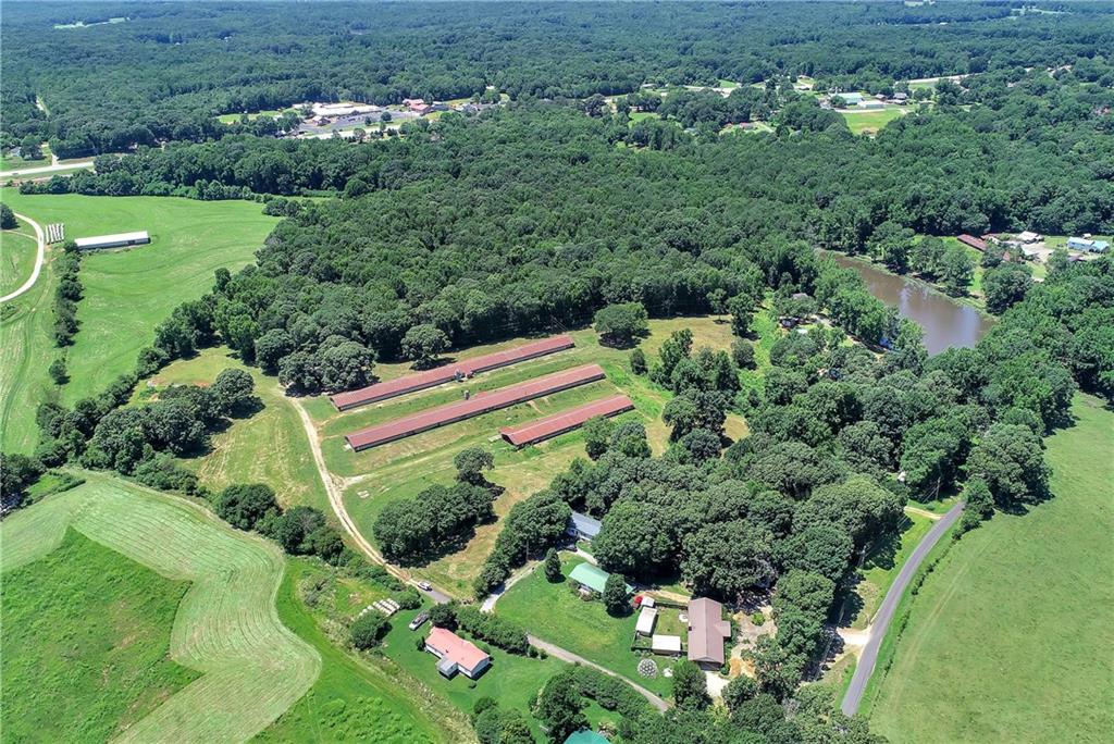 Great piece of property in Jackson County for a good price. The property is completely fenced in for cattle. It has a pole barn for parking the farm equipment. Also two small chicken houses that are not operational that would be great for hay or any other things you wanted to keep dry. County water is run to the property and power is already there also. It would make a great place to build a small family compound. Check this one out today.