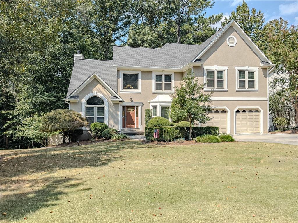 Updated 5BR/4BA Home in North Gwinnett School District
Move-in ready home in sought-after Lansdowne subdivision. Open-concept layout with
hardwoods on main, vaulted ceilings, and custom stone fireplace façade with flanked
built-in cabinets. Chef’s kitchen boasts granite counters, large island with microwave
drawer, double oven, gas cooktop, and beverage station. Main-level guest suite with
zero-entry shower and wide doorways. Upstairs owner’s suite features trey ceiling,
updated bath, plus two bedrooms with Jack-and-Jill bath. Basement offers bonus room,
full bath, and abundant storage. Recent updates: new roof, fresh paint, energy-efficient
windows. Private fenced backyard with mature landscaping and wooded lot beyond
creek.