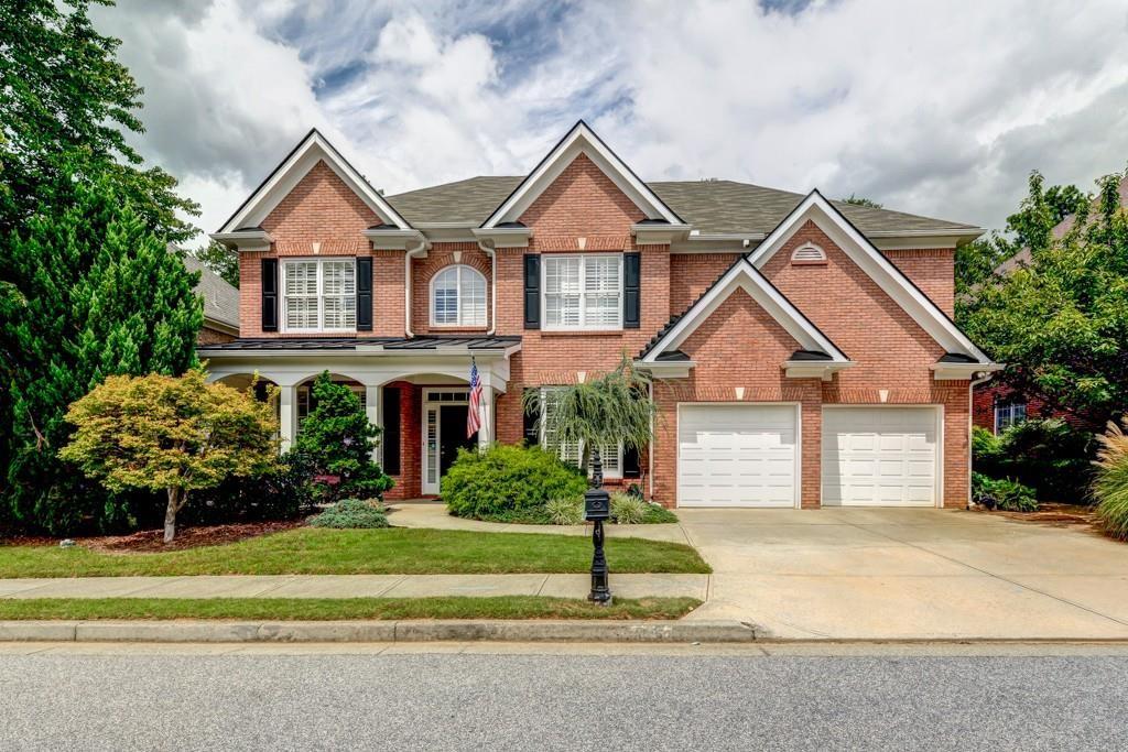 Lovely brick home located in Oakridge Estates Brick beauty with mature/lush landscaping in one of Smyrna's most sought after swim communities.  Spacious 4 bedroom 3.5 bath home with formal living room, formal dining, newer hardwood floors and expansive views to the vaulted family room with fireplace flanked by built in bookcases.  The kitchen opens up to a warm and inviting den with fireplace and cozy breakfast nook plus breakfast bar seating. Upstairs features generous master bedroom, dual vanity bath, and walk in closet.  All secondary bedrooms and baths are not undersized! Huge fenced in backyard with paved patio.  Located just minutes from the major interstates, The Battery, Vinings Village and Smyrna Market Village -