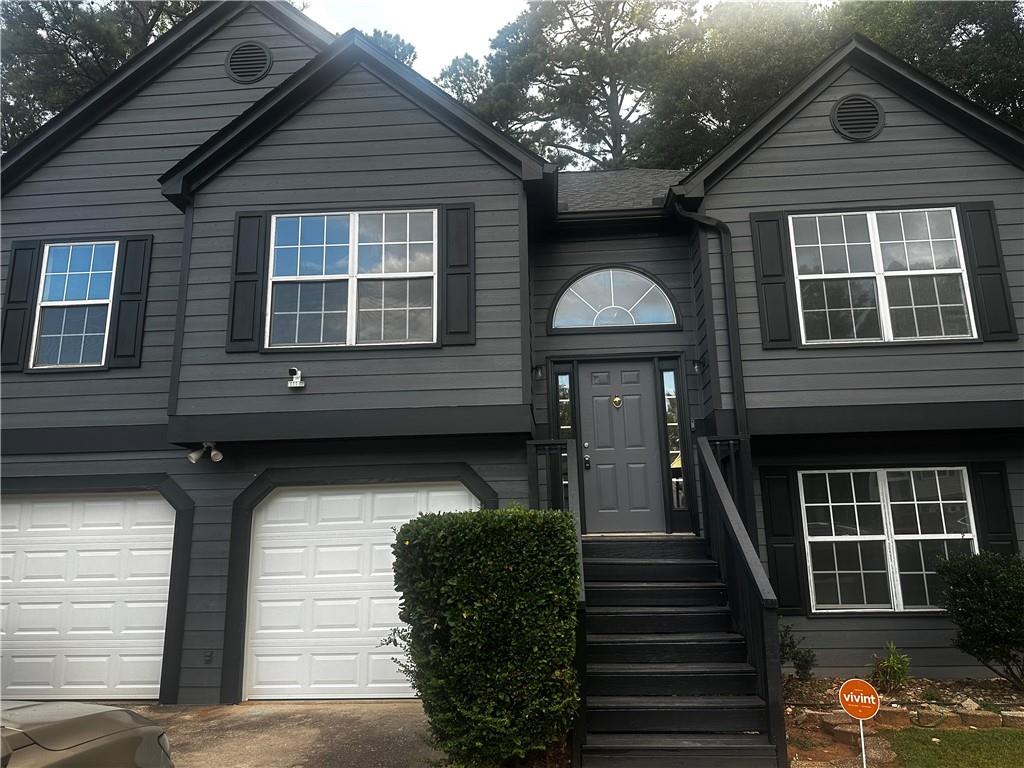 5 BED 3 BATH HOME. RENOVATED SPLIT LEVEL. NEW FLOORING, NEWLY PAINTED, NEW CABINETS, NEW COUNTER TOPS, NEW LIGHTING , NEW BATH FIXTURES, NEW APPLIANCES, FENCED BACKYARD. OWNERS SUITE HAS DOUBLE VANITY, TILED SHOWER AND GARDEN TUB. 2 ADDITIONAL FULL BATHS WITH TUB/SHOWER COMBO. LOWER LEVEL HAS 2ND LIVING SPACE INCLUDING KITCHEN, BEDROOM, FAMILY ROOM, DINING AREA TOO . NEW GARAGE DOORS, NEWER ROOF. YOU WILL LOVE LOVE LOVE THIS HOME
Down Payment assistance available to qualified Homebuyers through Preferred Lender! Great house in a quiet neighborhood this home is located less than a mile from beautiful downtown Powder Springs! Spacious split level that has had the entire interior repainted, Lots of natural light throughout this home, with a vaulted ceiling and wood burning fireplace in the living room. Nice back deck that overlooks the fenced in backyard. Upstairs features 3 bedrooms and 2 full baths. Primary bedroom has a walk in closet with it's own full bathroom with a garden tub and separate tiled shower. 3 bedrooms have laminate wood flooring Lower level features a laundry room, access to 2 car garage as well as 2 bedrooms with laminate flooring and a full bath. kitchen area living/dining combo area Covered front porch too! McEachern High School makes it a winner! No HOA for this great neighborhood