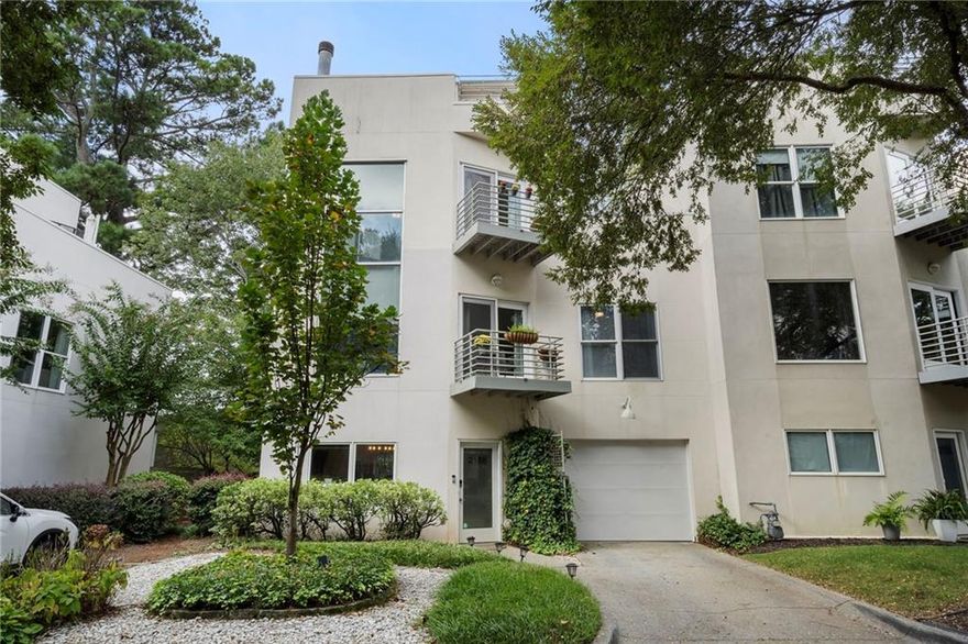 Welcome to this stunning 3-story contemporary townhome located in the heart of Brookhaven! Thoughtfully designed and beautifully updated, this home offers the perfect combination of modern style, functional space, and unbeatable location. The bright, open floor plan of this end-unit features a fireside dining area on the main level overlooking the fully renovated kitchen with quartz countertops and stainless-steel appliances. A convenient half bath and laundry room along with access to the one-car garage complete the main level. The second floor features a spacious living room and a comfortable guest bedroom, both filled with natural light, as well as a beautifully renovated full bathroom. The third floor is dedicated to the oversized primary suite, complete with a renovated en-suite bathroom. Enjoy the rare luxury of six private outdoor spaces, including a rooftop sky deck with incredible views, multiple balconies off the main living areas and bedrooms, and a private, fenced backyard. Natural light fills each floor, enhancing the clean, contemporary lines and comfortable layout. Situated just minutes from Brookhaven Village, this townhome places you in the heart of it all while still offering privacy and tranquility. Quick access to Buckhead, Midtown, and major highways.