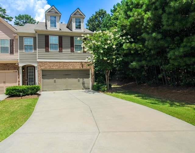 Welcome to 2662 Sardis Chase Ct - a stunning 3-bedroom, 2.5-bath townhome nestled in the highly sought-after Carlton at Hamilton Mill, a gated community in Buford, GA. This meticulously maintained home offers the perfect blend of comfort, convenience, and modern living. Step inside to a bright, open-concept layout with gleaming hardwood floors, high ceilings, and an abundance of natural light. The spacious living room flows seamlessly into a gourmet kitchen featuring granite countertops, stainless steel appliances, a breakfast bar, and ample cabinet space - perfect for entertaining or quiet evenings at home. Upstairs, you'll find a generous primary suite with a tray ceiling, walk-in closet, and a luxurious ensuite bath complete with dual vanities, a soaking tub, and a separate shower. Two additional bedrooms and a full bath offer plenty of room for family, guests, or a home office. Enjoy your private back patio, ideal for morning coffee or evening relaxation. The home also features an attached 2-car garage, upstairs laundry, and plenty of storage throughout. Located in the desirable Mill Creek school district and just minutes from shopping, dining, I-85, and the Mall of Georgia - this home checks every box. Community amenities include gated entry, swimming pool, fitness center, clubhouse, and playground. Don't miss your opportunity to own this beautiful townhome in one of Buford's premier communities - schedule your private showing today!