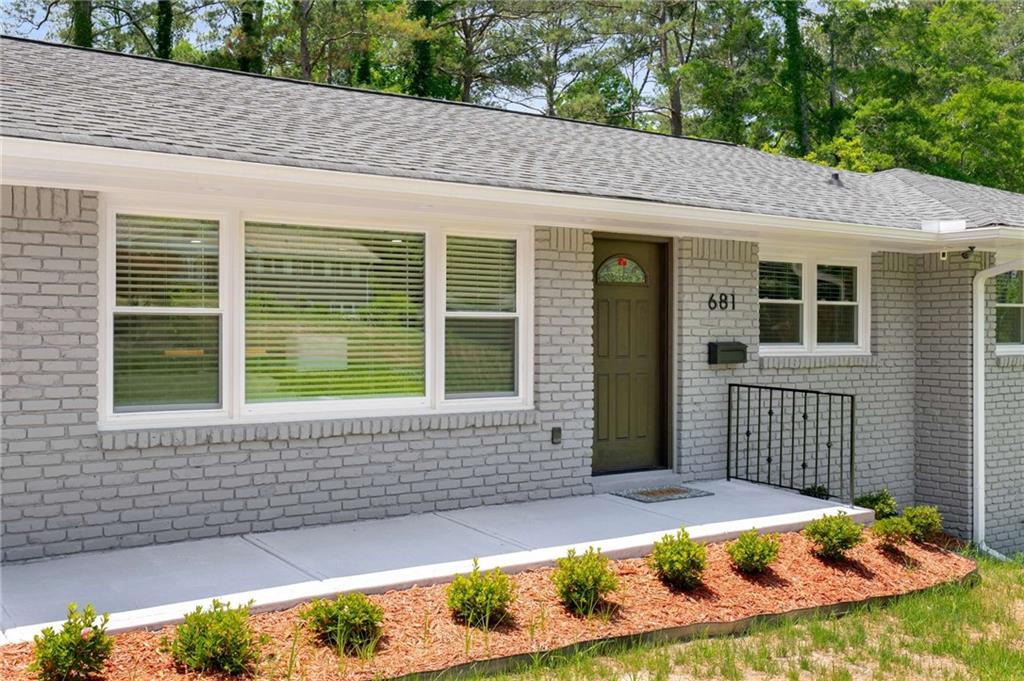 **THIS HOME QUALIFIES FOR A \$10,000 NO-STRINGS-ATTACHED GRANT – NO INCOME LIMITS. ASK FOR DETAILS!** Welcome to 681 Fielding Lane, where nearly every inch has been reimagined with High-End Upgrades and Modern Comforts—Without the Luxury Price Tag. Perfectly set on a Half-Acr, this 6Bbed, 4Bath Residence Spans over 3,000 sq feet and offers a thoughtful design for today’s lifestyle! Step inside and discover a Chef’s Kitchen Featuring Premium Finishes and a Seamless Connection to the Light-Filled Living/Dining Spaces. Just beyond, the 30x12 Deck w/Integrated Solar Lighting, which extends your Entertaining Space Outdoors. The Owner’s Suite is a True Retreat, complete with Vaulted Ceilings, LED Soffit lighting, and a Spa-Inspired Bathroom Boasting a Deep Soaking Tub, Body Sprayers, Floating Toilet, Heated Mirror, and a Private Wet Room. **Finished terrace level** adds incredible flexibility, featuring a full Jr. Suite with Kitchen, making it ideal for Multi-Generational Living, Guest Stays, or Potential Rental Income. A large Flex Space offers the perfect backdrop for a Home Theater, Yoga Studio, or Office. Additional features to call home include Designer Dual-Shower Guest Bath, 2-Car Carport with EV Charger, Fenced backyard with Low-Maintenance Landscaping, Smart Automated Floodlights for added security. Every upgrade was selected with intention—from the functional to the luxurious—providing peace of mind and true move-in readiness. Located minutes from Parks, Shopping, and Atlanta’s top Attractions, this gem Delivers the Rare Balance of Space, Style, and Convenience at a Price you’ll be Hard-Pressed to Find Again. Schedule your private tour today and experience the unmatched value for yourself.