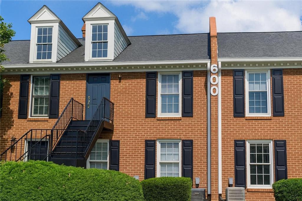Just 2.4 miles from Marietta Square. Newly Renovated condo located in a gated community with dedicated parking space. Complete with new granite countertops, brand new luxury vinyl plank flooring throughout, New white shaker style cabinets, all NEW appliances, and new paint. Two bed, two bath split roommate plan boasts large bedrooms each with their own bathroom and walk-in closet. Enjoy the privacy of second floor living with no one above you. The cozy living area features a fireplace, and the separate dining room leads into a bright sun room, filled with natural light. The galley kitchen is designed for efficient use of space. All situated in a gated community with a pool. Enjoy the convenience of being just minutes away from parks, dining, and shopping, making this location ideal for a vibrant lifestyle. Don’t miss your chance to own this meticulously updated condo in a prime Marietta location. Schedule a showing today! This won't last long. Seller will entertain all requests. Staging pics are AI enhanced