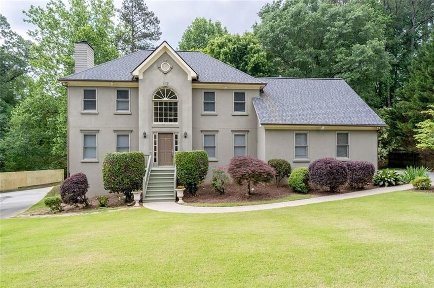 Welcome to your new  home in East Cobb ! Great location minutes to restaurants and stores. The grounds have beautiful bushes, trees and nice green spaces. The entire house has been freshly painted and offers hardwoods on the main & upper level. Large eat in kitchen. with a breakfast bar, granite counter tops, stainless steel appliances, Separate dinning room, and the living room  is perfect for relaxing with the fireplace.  The laundry room, and half bathroom are also on the main floor. The second floor has a large primary bedroom , with a walk in closet and an en suite with a shower and separate jetted tub. There are also two guest bedrooms and a full hall bathroom. The lower level has two bedrooms with new carpet and a full bathroom, and a large bonus room with a kitchenette and TV room. It also has a separate entrance! The large back deck has been freshly painted and has a nice flat yard. There is a large 2 car garage and a long driveway. Come make this lovely house , your happy place.