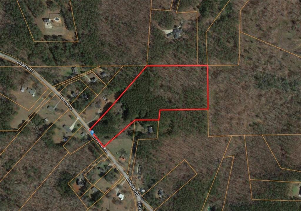 Don't miss this chance to be a land owner! 13+ acres in Winston, GA with mature trees, including pine! Hardwood trees abound. Road frontage, a natural spring and so much potential! Fence it and farm it, keep it for hunting and camping, or build your dream home! Call today!