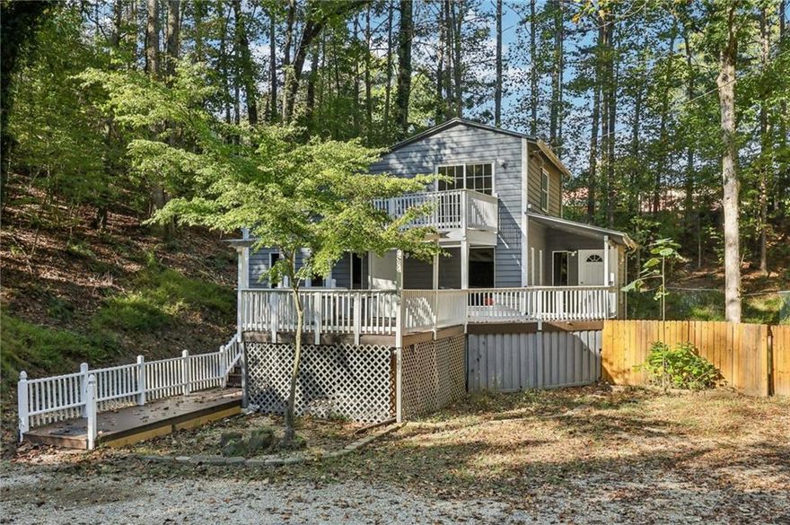 Beautifully updated 3-bedroom, 2-bathroom home nestled on a serene, private wooded lot in one of Cumming’s most convenient and sought-after locations. This move-in ready home is ideally located close to top-rated schools, shopping, dining, GA 400, and beautiful Lake Lanier.

Step inside to find an inviting kitchen that opens seamlessly to a fireside living room—perfect for relaxing or entertaining. The main level features two bedrooms and a full bath, offering flexible living options for everyone. Upstairs, retreat to your large primary suite with a walk-in closet and a private balcony overlooking the peaceful yard—your own secluded sanctuary. Outside, spacious upper and lower decks are perfect for grilling or entertaining. 

Enjoy the perfect balance of comfort, convenience, and natural beauty in this exceptional property.

Don’t miss the opportunity to make this wonderful home yours!