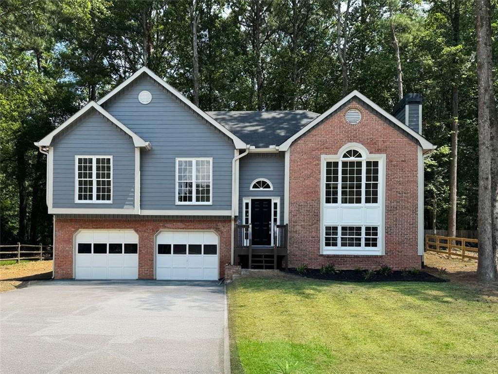 Welcome to your beautifully updated home in the sought-after Country Walk community of Powder Springs! This spacious 4-bedroom, 3-bathroom residence offers the perfect blend of comfort, style, and convenience. Recent updates include fresh interior and exterior paint, new carpet in bedrooms, refinished hardwood floors, updated light fixtures, and deck and porch maintenance, making this home truly move-in ready. Step inside to a light-filled main level featuring vaulted ceilings, a cozy gas fireplace in the living room, and a separate dining room ideal for entertaining. The eat-in kitchen boasts stone countertops, stained cabinets, and a pantry. The oversized primary suite on the main offers a walk-in closet and a bathroom with double vanity and separate tub/shower. Downstairs, a finished lower level includes an extra bedroom and bonus space, perfect for a media room, office, or guest suite. Enjoy the outdoors on your screened-in porch and private backyard, or take advantage of the resort-style amenities in Country Walk: swimming pool, tennis courts, clubhouse, playground, and direct access to the scenic Silver Comet Trail, perfect for walking, biking, or jogging. Located in a well-established, owner-occupied community with quick access to Atlanta, shopping, dining, and top-rated Cobb County schools. This home truly has it all and qualifies for $10,000 in FREE grant funds, with the Truist CHIP program!