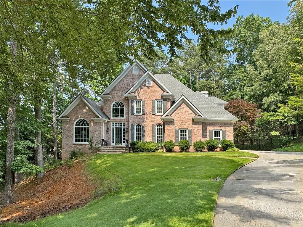 WOW! Newer Windows! Don’t miss the opportunity to make this beautiful 4 bed, 3.5 bath, primary-on-main, move-in ready traditional home in the sought-after Alpharetta swim/tennis community of Nesbit Lakes your own! Tucked back on a quiet cul-de-sac lot, this home boasts gleaming hardwood floors throughout the main level, stunning palladium windows, soaring two-story ceiling living spaces, fabulous screened in deck overlooking the private tree-lined backyard, and more! The main level features a light, bright two-story foyer, formal living room- perfect for a home office, formal dining room, half bath, two-story fireside family room that leads out to the relaxing screened in deck, and the spacious kitchen complete with granite countertops, stainless appliances, gas cooktop island, additional breakfast bar/island, adjacent window-side breakfast area, AND adjacent fireside keeping room- a fabulous spot for family or guests to relax while meals are being prepped! Additionally on the main level, you’ll find the oversized primary bedroom with tray ceiling, dual walk-in closets, and the updated ensuite primary bath with separate vanities, walk-in shower and separate soaking tub! Upstairs, you’ll find three generously sized guest bedrooms— one with an ensuite bath, the other two sharing an additional bathroom. The full daylight, walk-out terrace level is unfinished, stubbed for bath, and ready for you to customize to your liking! Outside, you’ll also find a large patio off of the main level, surrounded by the peaceful, private, tree-lined, fenced in backyard! Newer windows, newer roof! Nesbit Lakes offers an amazing array of amenities including a large active swim and tennis complex with gathering areas, fire pits and more, a playground, a clubhouse, and community lake access. Conveniently located within walking distance to top-rated private and public schools and offering easy access to GA 400, Historic Roswell, Downtown Alpharetta, Country Club of Roswell, and Avalon, this property is perfectly situated for you to enjoy the best of what the area has to offer!
