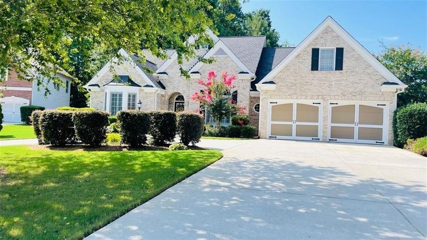 Welcome home! Beautifully spacious ranch home in pristine Lakefield Manor subdivision located in West Cobb! This beautiful 4 bedroom 3.5 bath brick front ranch home is situated on a level, corner cul-de-sac lot. The home has a spacious circular driveway along with a 6-car capacity driveway and 2 car garage. Foyer entrance boasts of high ceilings, with views to the separate dining room. Main level also features roommate floor plan with relaxing owner’s suite on one side of the home including large ensuite bath, double vanities, separate garden tub and shower and large walk-in closet; while the other side of the home includes 2 additional bedrooms with Jack and Jill bathroom. Family room includes gas log fireplace, built in bookshelves and coffered ceilings and a wall of windows providing plenty of natural light. Rounding out the main floor is an eat-in kitchen with stainless steel appliances, granite countertops and pantry, an office/library (also with built in bookshelves) and the laundry room. Upper level includes the 4th bedroom and full bath perfect for a private guest or teen suite or extra storage space. Private, nicely landscaped backyard includes large patio perfect for relaxing and entertaining. The home is also equipped with a sprinkler system for the front and back yard. Neighborhood amenities include two swimming pools, tennis courts, central park, two lakes (stocked with fish) and walking trails. The community is close to shopping and is less than 3 miles from Kennesaw Mountain trails and hiking. Marietta Square and Battery Atlanta are also nearby. Schedule your appointment today to see all this home has to offer!