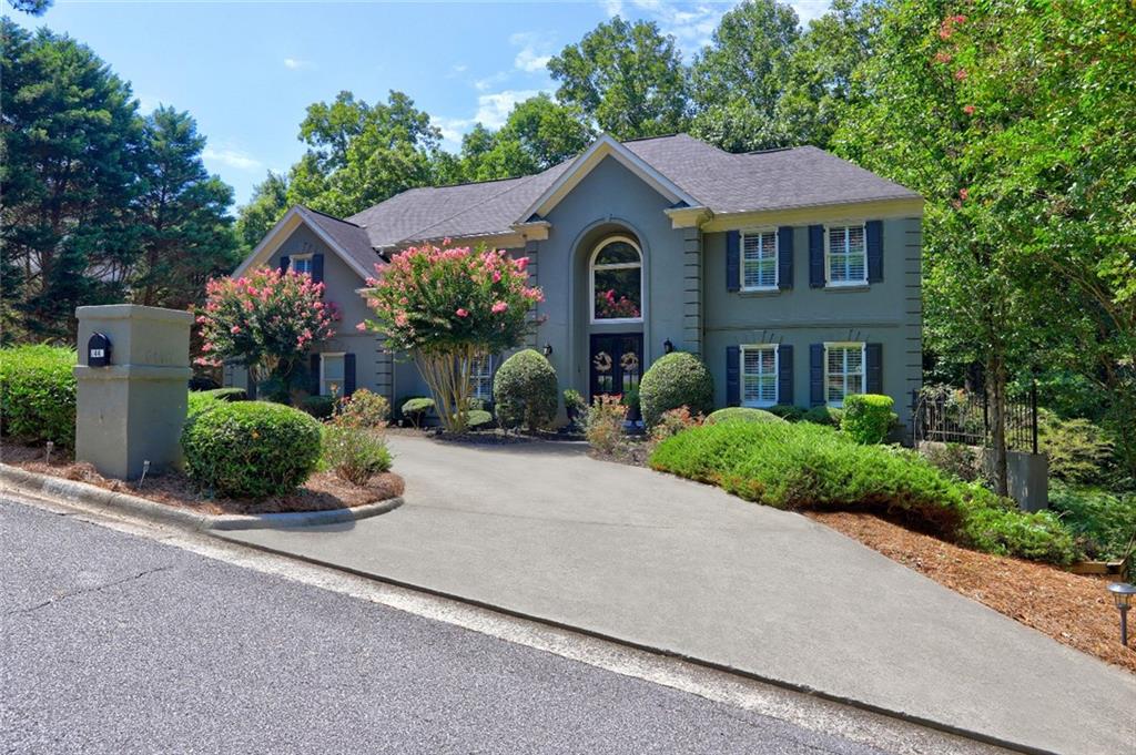 Introducing this Exquisite home in prestigious Huntcliff community that sits on 0.86 acres. This home truly offers LUXURY!! Huntcliff residents enjoy an array of exceptional amenities, such as an equestrian center, golf course, tennis courts, pool, private boat dock for canoeing, playground and clubhouse. In addition, Huntcliff owns 20+ acres of private preservation land along the Chattahoochee river and home to Cherokee Town and Country Club.
This home offers a seamless transition between indoor elegance, breathtaking natural surroundings and is tailored for multigenerational living. From the moment you step onto the front porch, this gorgeous home will be calling your name. The grand foyer entrance with high ceilings leads the way to a stunning formal living room, an oversized dining room which brings you to a vast open concept living space to include a beautiful gourmet eat-in kitchen with beautiful counter tops, large center island, abundance of white cabinetry and elegant built in high end stainless appliance packages. The great room with fireside that opens up to a large deck where you can entertain or relax with a glass of wine after a long day. The Main level also features a spacious bedroom with full bath great for in-laws or guest. Meandering up the hardwood stairs or stairwell off the kitchen you will find the gorgeous oversized owners retreat built for two complete with a large walk in closet and a renovated en suite offering massive two separate vanities, relaxing soaking tub and a nice seamless glass surround shower. The spacious secondary bedrooms have high ceilings and walk-in closets; one offers a private bath the other secondary bedroom share a Jack and Jill with full bath. Let’s not forget the terrace level where you will find the mammoth unfinished daylight basement is studded for a full bath, ready to finish to fit your desires with over 2400 square feet and 16 foot ceilings perfect for theater, game room in-law suite or whatever you can imagine. This masterpiece is truly an entertainers dream and will not disappoint. Other notables include: Hard coat stucco, New water heater, New furnace and HVAC system, professional lighting package, front and back, beautiful landscape yard, 12 foot ceilings First and second level of the home, Basement 16 foot ceiling and so much storage space.