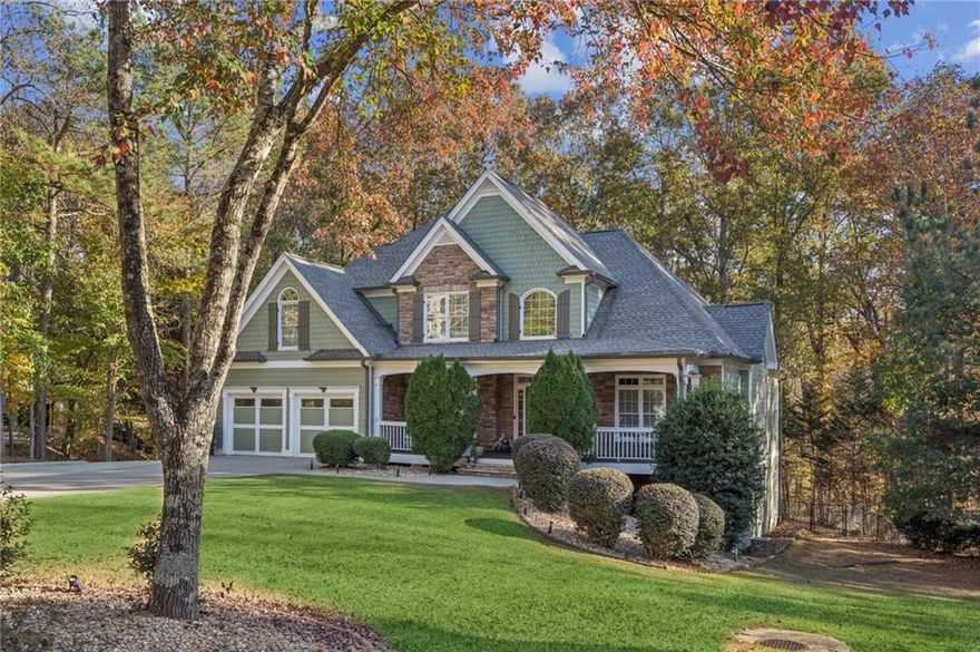 Beautifully designed 5 bedroom, 3.5 bath Craftsman-style home located just minutes from Lake Lanier!  This stunning residence welcomes you with a two-story foyer featuring a triple trey ceiling that opens to a spacious great room perfect for entertaining or relaxing by the fire.  The formal dining room showcases elegant inlaid wood floors and trey ceiling creating the perfect setting for gatherings. The updated kitchen boasts modern finishes and opens to a cozy keeping room making it the heart of the home. The  primary suite on the main level offers convenience and comfort along with a main level laundry room just off the kitchen.  Upstairs you'll find three additional bedrooms and a Jack and Jill bath providing plenty of space for family and guests.  The finished terrace level is ideal for entertaining or multi-generational living featuring a large rec room with fireplace, theater room, bedroom, full bath, kitchenette, second laundry hook up and two spacious storages rooms. Enjoy the craftsmanship, space and versatility of this exceptional home.  Schedule your private tour today and make this your new home for the holidays.