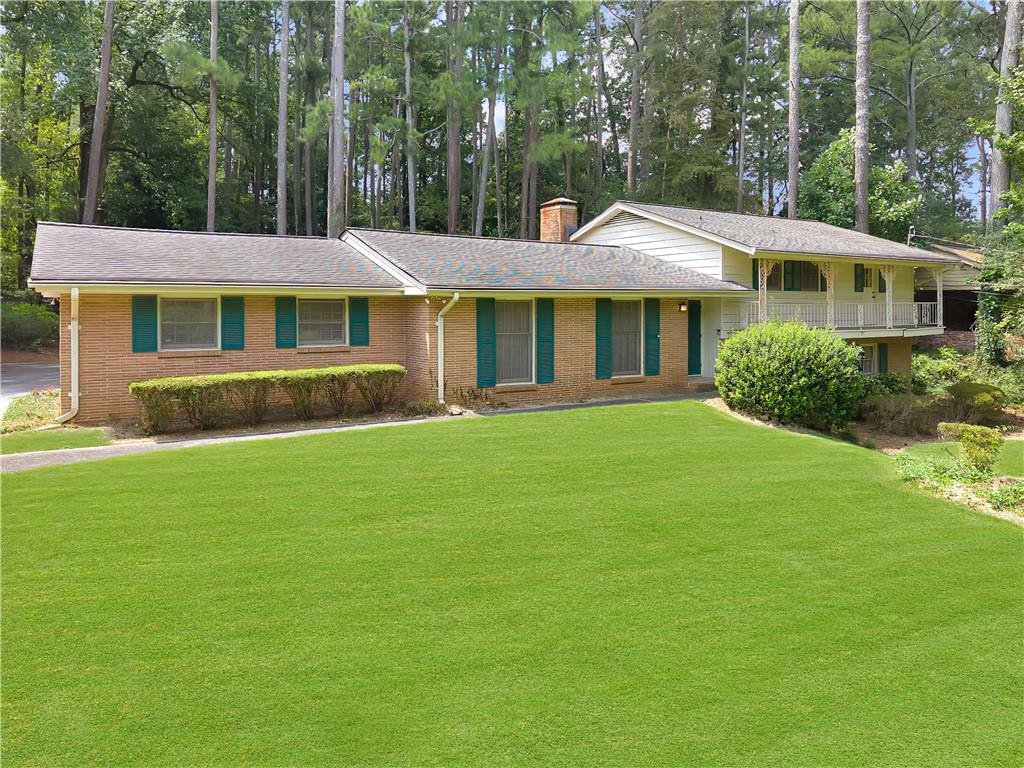 Charming 1961 split-level ranch with endless potential in a park-like setting. Offered for the first time by the family, this well-maintained 4-bedroom, 3-bath split-level ranch is ready for its next chapter. Built in 1961 and lovingly cared for ever since, this home has been the backdrop of many treasured memories—and now it offers the perfect opportunity for a new owner to create their own dream home. Sitting gracefully on a gentle hill, the home is surrounded by lush, mature landscaping that feels like your own private botanical garden. Native azaleas, hydrangeas, and a variety of established shrubs frame a sprawling lawn, creating a tranquil retreat where you can enjoy coffee or wine on the back patio while soaking in the view. The manicured front yard is equally inviting, with a balcony overlooking the greenery and a neighborhood known for its warm, welcoming community. Hawthorne Elementary is just around the corner, and neighbors of all ages contribute to the friendly, vibrant feel. Inside, you’ll find original hardwood floors and an abundance of space across multiple levels. The lower level is a true highlight, offering incredible flexibility with a 4th bedroom, a 3rd full bathroom, and a large bonus room with its own separate entry and patio. This versatile space can easily be reimagined as a 5th bedroom, recreation room, teen suite, in-law suite, short-term rental, or even a home office. The possibilities for extra living space or income potential are endless. A partial basement provides even more space with room for a workshop and ample storage.
Life here also comes with enviable community amenities and convenience. The neighborhood offers optional membership to the Briarmoor Manor Pool, currently being renovated, with one of the area’s top swim teams. You’re also close to Globe Academy, Mary Scott Nature Park, and all the perks of inside-the-perimeter living. Shopping, dining, and entertainment in Decatur, Downtown Atlanta, and Buckhead are minutes away, with quick access to interstates 85 and 285. The new Arthur Blank Children’s Hospital, CDC, and Emory are all nearby as well, making this location as practical as it is desirable. Whether you’re looking to restore its mid-century character or design a modern dream home, this property offers a rare opportunity: a spacious house, a beautiful lot, and a neighborhood that buyers dream about. Bring your vision and see what’s possible. Estate owned, sold AS IS with right to inspect.