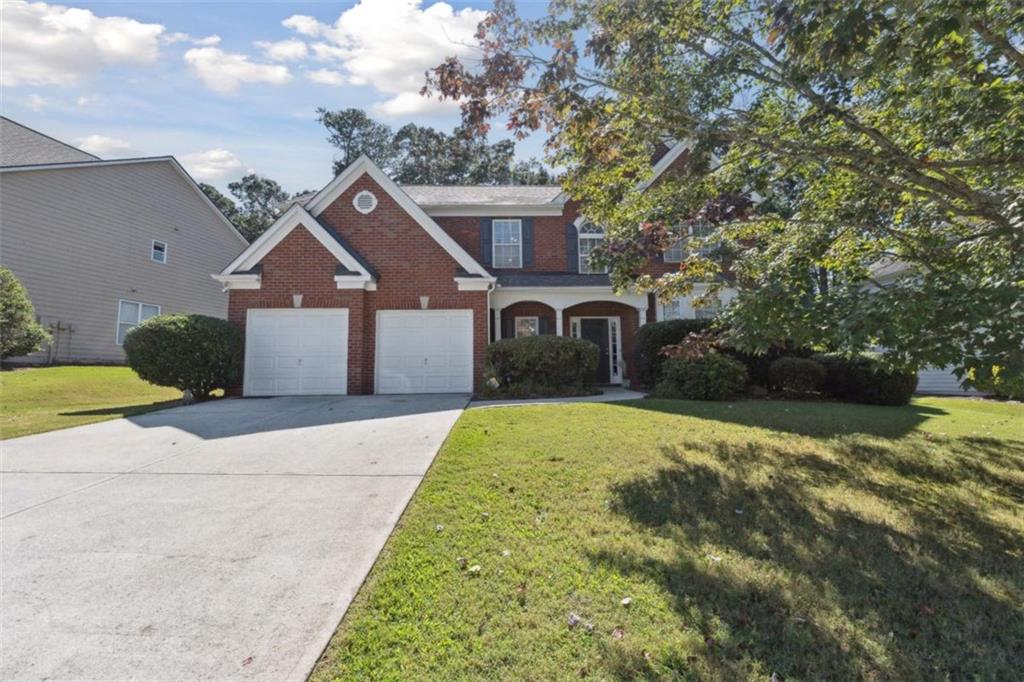 *SELLER OFFERING A $15,000 FLOORING AND PAINT ALLOWANCE WITH A FULL PRICE OFFER*
This spacious 4-bedroom, 2.5 bath home is located in the highly coveted Daniel Park neighborhood. Located within a highly desired school system, this home is just minutes from I-85, the Mall of Georgia and the coveted Hamilton Mill area. The kitchen offers a practical open layout with plenty of cabinets and a large pantry for extra storage. There is easy access to the formal dining room and an eat-in nook perfect for casual and relaxed meals. When entering the main living area, you can't help but notice the impressive cathedral ceilings. The additional windows in the room allow for plenty of natural light to flood the space The open and airy staircase leads you up to 4 bedrooms that are thoughtfully laid out. The primary suite features vaulted ceilings, a double vanity, soaking tub, separate glass enclosed shower and a walk-in closet. The remaining 3 bedrooms share a conveniently located hall bathroom. You will also enjoy the ultimate convenience of an upstairs laundry room for ease of use! Your private backyard is fully fenced and the natural trees surrounding the area give it a peaceful and wooded feeling. As part of this desirable community, the HOA provides access to the swimming pool, tennis courts, a playground and a small lake. You can also enjoy a nice walk or bike ride on the well-maintained sidewalks throughout the neighborhood. In addition to these amenities, you will be invited to join in events that create a "community hub" to foster friendships and connect with neighbors. With a brand new water heater and brand new main level HVAC unit, this property is ready to become your next home. Schedule a showing today!