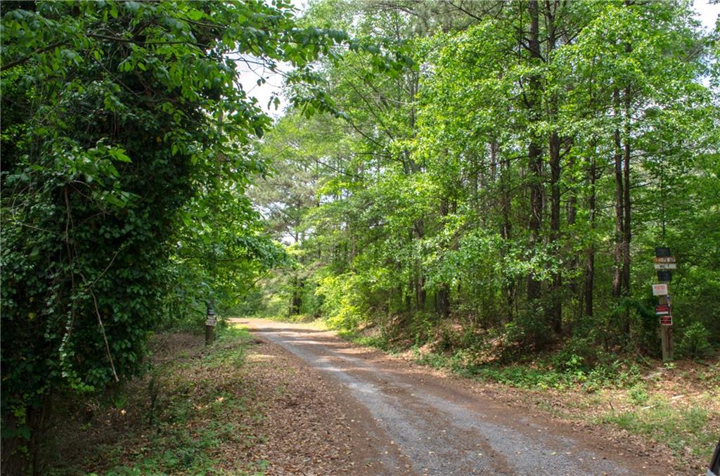 BACK ON THE MARKET-50 ACRES in Woodstock High School district. This kind of property no longer exists. Ready to be developed! Perfect for multifamily use!  Property has a natural spring, 2 creeks, with rolling hills. Plenty of hardwoods for timber.  Easy access to I575, retail shopping, and outlet mall. Don't wait.