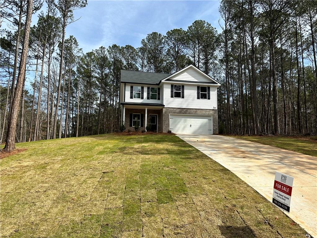 Lake Jackson community. Escape busier cities like McDonough and Covington for quiet high amenities style community including pool, tennis, beaches.
Rose plan features 1 bedroom on the main level with full bath and primary plus 2 other bedrooms upstairs. Main floor has 2 story great room open to the island kitchen with dining space all opening onto rear patio and flat yard,
Primary bedroom has walk in closet, faces the front yard and attached bath suite includes over sized shower, double sinks and granite tops. Separate water closet. Laundry is in central upper hall. 2 secondary bedroom upstairs overlook back yard space.
Builder has great incentives and preferred lender also contributes!