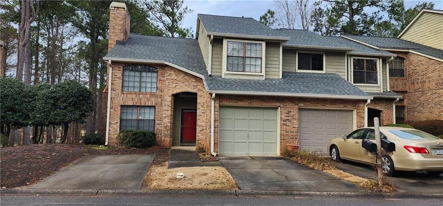 One of the largest, end unit in the complex! 3 levels of living space! Bright, open kitchen! 2-story great room with a cozy, wood burning fireplace. Dining room with Harwood floors. Huge loft. Romantic master bedroom. Updated master bath. Finished daylight  basement features and in-law or teen suite complete with a full bath. Custom deck.  Enjoy the low-maintenance lifestyle with an HOA that covers all exterior maintenance, along with water/sewer, trash, termite and more, allowing you to spend more time doing what you love. Plus, with quick access to GA 400 and 141, getting anywhere in the city is a breeze. Property does need some TLC.