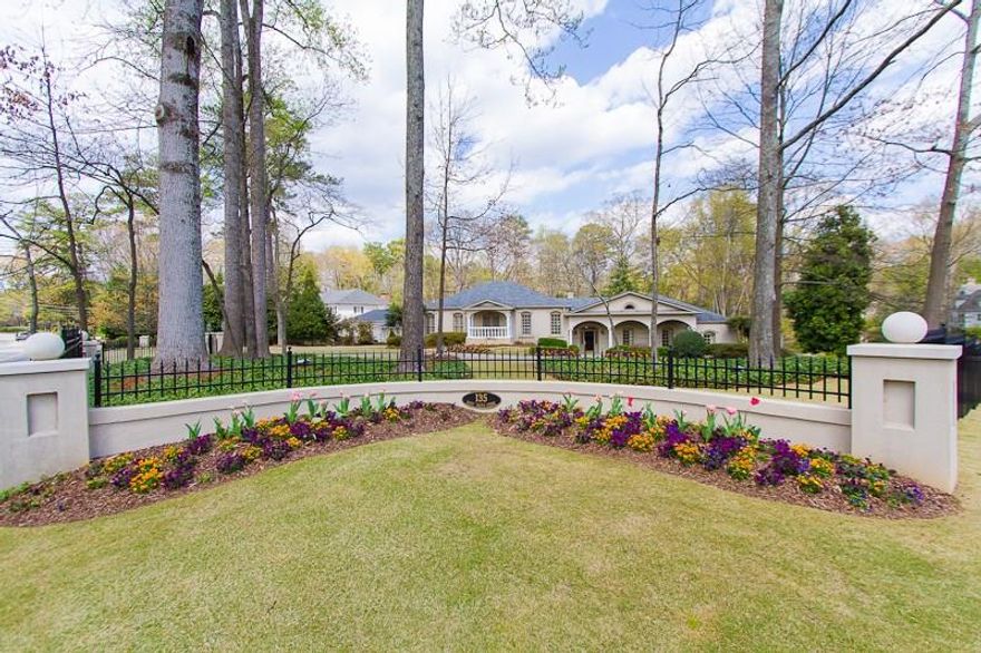 Gorgeous, completely updated traditional home on Buckhead's most prestigious street. Large, open, light-filled living spaces. Dark hardwoods, high ceilings & archways, elegant moldings & Circa lighting throughout. Private backyard oasis w/travertine/marble deck, Pebble Tec pool, waterfall & spa. Beautiful, sleek kitchen w/marble countertops, Thermador appliances & walk-in pantry. Master suite has soaring ceilings w/balcony overlooking the pool, large bath w/his & her vanities. Fireside rec room, wet bar, large media/play room. 2 Harrison Design remodeled bathrooms.