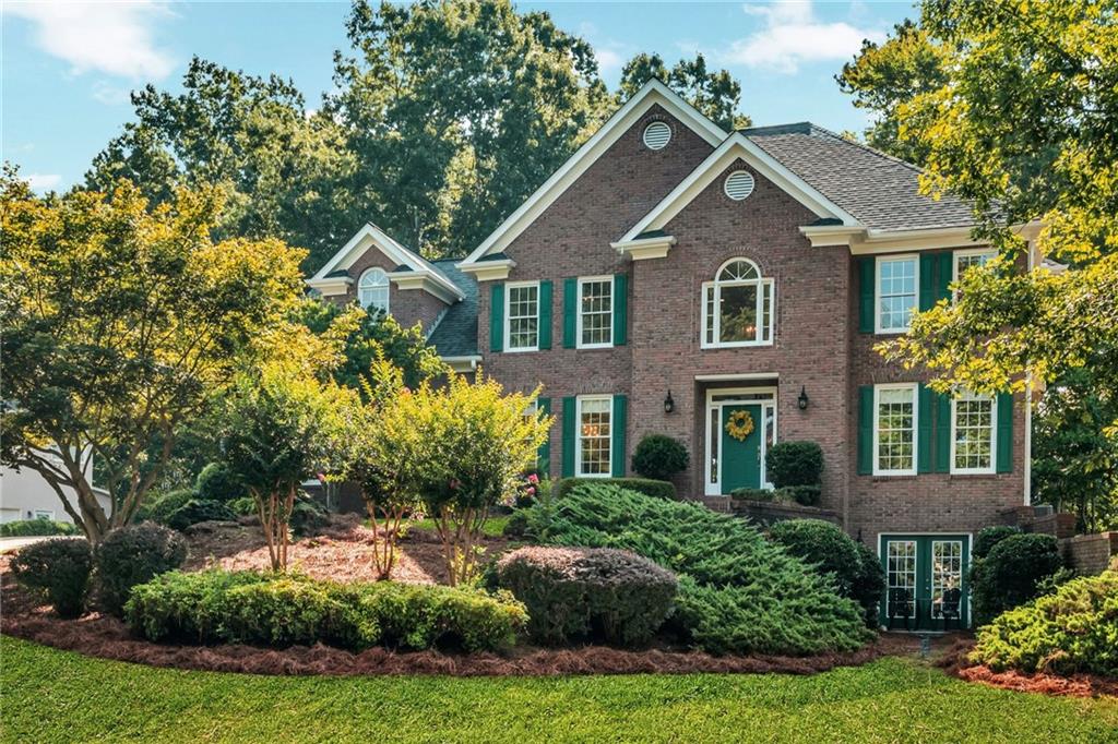 Welcome to 576 Fairway Drive, located in the highly sought-after Fairways at Towne Lake—a vibrant swim/tennis community in the heart of Woodstock. This beautifully maintained 5-bedroom, 4-full-bathroom home offers thoughtful upgrades, flexible living spaces, and a peaceful backyard retreat that backs up to protected Corps of Engineers property for enhanced privacy and serene views.
From the moment you arrive, the charming brick front, manicured landscaping, and blooming crepe myrtles lining the front yard create standout curb appeal. The clean, two-car garage and freshly painted exterior add to the home’s inviting presence.
Step inside through the main single-door front entrance to a bright two-story foyer, featuring double coat closets, upgraded lighting, and wide plank LVP flooring (installed 2019) that flows throughout the main level. The floor plan includes a formal dining area, a flexible front room, and an open-concept living room adjoining a remodeled kitchen—featuring Cambria quartz countertops, gas stove, counter-depth refrigerator (included), and upgraded cabinetry.
A main-level bedroom and full bath offer flexibility for guests, work-from-home setups, or other lifestyle needs. Step out to the newly added screened-in porch and enjoy your morning coffee overlooking the level, beautifully landscaped backyard—a true outdoor oasis.
Upstairs, the oversized primary suite boasts two walk-in closets and a spacious bath with dual vanities. One secondary bedroom includes a private en suite bath, while two others share a Jack-and-Jill bathroom, offering a functional and well-balanced layout.
The full unfinished basement is already stubbed for a bathroom and features a separate double-door exterior entrance—ideal for future expansion into additional living space, a studio, workshop, or private suite.
Property Highlights:
• 5 bedrooms 4 full bathrooms
• Beautifully landscaped with blooming crepe myrtles
• Brick front with two-car garage
• Remodeled kitchen with Cambria quartz countertops
• Wide plank LVP flooring (2019)
• New screened-in porch
• Backs up to Corps of Engineers property
• 8-year-new roof | 2-year-new water heater
• Double-pane wood windows
• Fresh exterior paint including all trim
• Swim/tennis community amenities
This home combines space, style, and location in one of Towne Lake’s most desirable neighborhoods. Come experience the care, comfort, and potential of 576 Fairway Drive.
