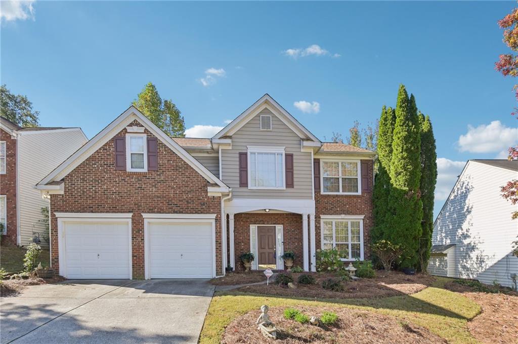 Welcome to this classic brick-front two-story home located in a lovely Canton community within walking distance of the great amenities, including a clubhouse with wraparound porch, large pool, tennis courts, and a playground. The perfect gathering place for neighbors and friends. This home offers wonderful curb appeal with dual garage doors for added privacy, ample parking and storage, and manicured landscaping framing a covered front porch, ready to be decorated for the holidays. Step inside the two-story foyer, where hardwoods flow into a formal living room, ideal as a home office or sitting area and opens to the formal dining room, highlighted by decorative columns and wainscoting for timeless elegance. The eat-in kitchen features an island with breakfast bar, pantry, and an additional dining area, creating a comfortable space for everyday living and entertaining. Easy access to the patio for indoor-outdoor living year-around. The adjoining family room centers around a classic fireplace, perfect for cozy evenings ahead. A half bath completes the main level. Upstairs, a spacious landing provides a quiet reading or sitting area. The primary suite boasts a tray ceiling and French doors leading to a vaulted en-suite bathroom complete with a double vanity and makeup counter, garden tub, and walk-in shower. Three additional bedrooms and an additional full bath, along with a laundry room conveniently located near all bedrooms, making laundry day a breeze. Outside, enjoy a fully fenced backyard offering privacy and space to relax or dine under the stars on the patio. There's also a storage shed perfect for tools, outdoor equipment, or seasonal décor. This home is move-in ready with plenty of opportunity to customize and update to your personal style. Ideally located near grocery stores, parks, schools, and recreational facilities, plus great shops, dining, and downtown Canton favorites. You’ll love the perfect blend of comfort, community, and convenience this home provides.