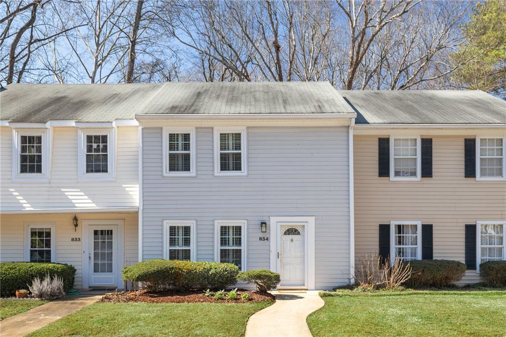Tucked away in the quiet Clairmont Heights neighborhood near Emory, CDC, CHOA, and the VA Hospital, this home provides easy access to highways, restaurants, shopping, and scenic neighborhood trails. This unit features new hardwood floors, an oversized master with two closets and new light fixtures adding warmth and charm. The kitchen, featuring granite countertops, stainless steel appliances, and ample cabinet space, flows effortlessly into a bright dining area and a private fenced in patio perfect for entertaining or unwinding with a peaceful wooded view. With abundant storage inside and out including attic space, the community offers plenty of parking and access to a community pool / clubhouse. Located in the sought-after Fernbank Elementary district, it's also in a short proximity to Emory Village, Toco Hills, Mason Mill Park and a nature preserve.