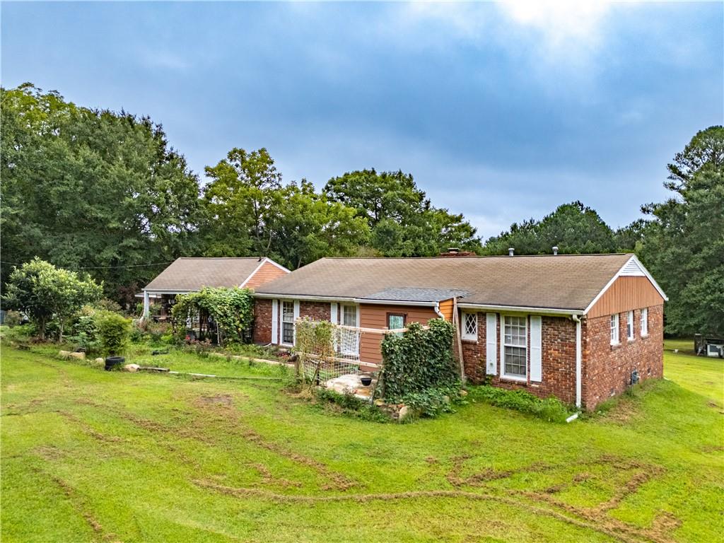 Charming Mini-Farm Opportunity Just 6 Miles from ATL Airport! Welcome to 6250 Feldwood - a rare 3-acre property offering space, privacy, and endless potentials in the growing College Park area! Nestled just minutes from Hartsfield-Jackson International Airport, this unique property features a spacious 5 bedroom, 5 bath and 2 kitchens home (quasi duplex), set back from the road, surrounded by open land and mature trees -ideal for homesteading, gardening, or creating your own private retreat.
Inside, you will find a bright and functional layout with hardwood floors, large windows, and a cozy family room. The partially updated kitchen includes ample cabinetry and flows into a separate dining area. The primary suite includes an ensuite bath and generous closet space.
Outside, enjoy the expansive backyard, perfect for small livestock, recreational use, or even building an additional structure (pending permits). Whether you are looking for a primary residence with land, an investment opportunity, or a peaceful property close to the city, this one checks all the boxes. No HOA. Easy access to I-285, downtown Atlanta, and major employers. Bring your vision and explore the opportunities!