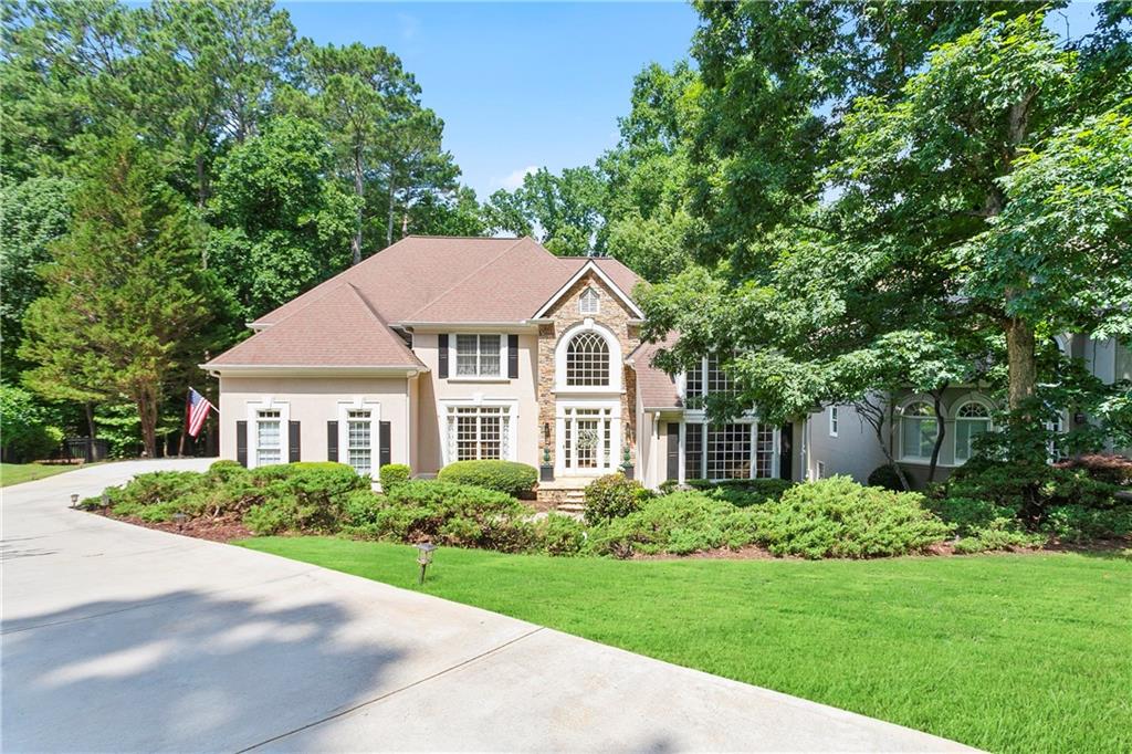 Welcome to Your Dream Home in Seven Oaks – A Truly Special Find in Johns Creek/Alpharetta area.
Located in the heart of the prestigious Seven Oaks subdivision and within the highly acclaimed Northview High School district, this beautifully maintained 5-bedroom, 4.5-bath home offers the perfect blend of space, comfort, and lifestyle.
Step into your own private oasis—a resort-style swimming pool designed for both relaxation and entertainment, nestled in the lush backyard of this luxurious estate. Surrounded by mature landscaping and palm accents, the pool sparkles under the sun, offering a tranquil escape and a centerpiece for unforgettable gatherings.
Tucked away on a private, wooded lot, you’ll immediately notice the fantastic curb appeal and lush landscaping. Step inside to a bright, two-story foyer that opens up to elegant formal living and dining areas—perfect for gatherings and special occasions.
The light-filled white kitchen features a breakfast bar and flows seamlessly into a dramatic two-story family room, creating the ideal setup for entertaining or relaxing. Step out onto the large well made sunroom, where you can enjoy your morning coffee or host a cookout with friends.
On the main level, you’ll find a master bedroom, convenient laundry room, and a powder room. Upstairs additional bedrooms include one with its own private bath and two that share a Jack-and-Jill bath—perfect for kids or guests.
The home features beautiful hardwood floors, plantation shutters, and a roomy 2-car side-entry garage. And don’t forget the fully finished basement—complete with a wet bar, media room, and versatile spaces for entertaining, a home gym, or even a private in-law suite.
Living in Seven Oaks means enjoying a true resort lifestyle. This vibrant community offers an Olympic-sized pool, kiddie pool, 8 lighted tennis courts, pickleball, a clubhouse, fitness center, soccer field, scenic walking trails, a community lake, and a gazebo area that hosts events year-round—from concerts to weddings.
Community located just minutes from Avalon, Halcyon, and Emory Johns Creek Hospital, this location offers convenience with upscale living.
Don't miss your chance to live in one of Johns Creek’s most sought-after neighborhoods. This home truly has it all—space, charm, and unbeatable community amenities.