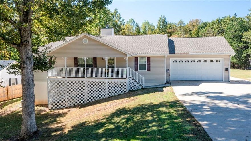 Welcome home to this beautifully maintained ranch-style home featuring a desirable split-bedroom layout, rocking-chair front porch, and full - partially finished basement. Inside, you’ll find a spacious great room with a vaulted ceiling and a travertine-accented fireplace—perfect for cozy evenings. The kitchen boasts antique-finished cabinetry, stainless steel appliances, breakfast bar, and a open dining area for effortless entertaining.The primary suite offers a beautifully refreshed private bath, while two additional bedrooms share a large hall bath. The laundry and pantry combo is both functional and intentional providing plenty of storage  and the two-car garage provides plenty of space for storage or large vehicles. Downstairs you'll find the massive basement—with high ceilings, painted floors, and a finished flex-room with a full bathroom—offering endless potential for an in-law suite, home gym, playroom or office.The true highlight of this property is the outdoor entertaining area - its the ultimate backyard retreat with a deck made for dinners, a hot tub for unwinding, a pool for summer days, and a firepit for cool evenings. No worries if the power goes out - the main living area has a Generac generator. Conveniently located near shopping, dining, and top North Georgia amenities—quiet subdivision with NO HOA.