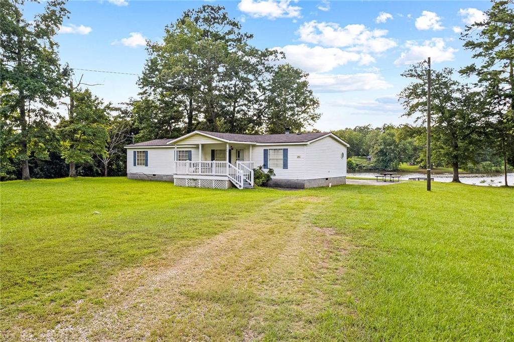 Beautiful lakefront home! Enjoy 3 spacious bedrooms and 2 bathrooms. This home features a large kitchen and a spacious living room with Lake views. Nice hardwood floors, updated bathroom vanities, nice paint throughout the home. Big yard and nice remodeled deck to enjoy your lakeview. This home is less than 10 mins away from Atlanta Motor Speedway. This home can be a great primary home, second home or rental property.