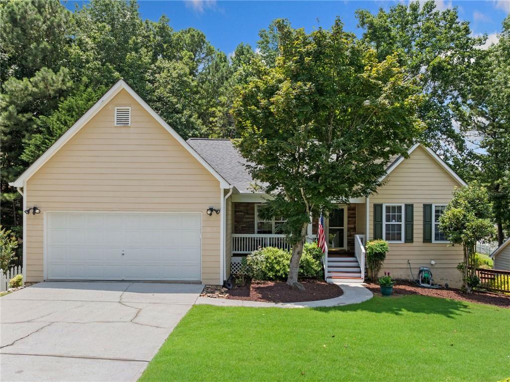 Step into this charming ranch home on a full daylight basement and feel the warmth embrace you! With its inviting front porch, this residence is perfect for creating lifelong memories with your family. The primary suite offers a freshly updated full bath with all new spacious walk-in shower, a new linen closet, and a cozy sitting room that offers tranquil views of the serene, wooded backyard.
The kitchen with all new ss appliances seamlessly connects to the dining area and family room, embodying the open concept design ideal for family gatherings. A new sliding door from the sunny breakfast nook leads you to the renovated upper deck where you can unwind and take in the peaceful sights of nature.
The current office space can effortlessly transform into a bedroom with the addition of a closet, providing flexibility for your family's needs. Enjoy the beauty of hardwood floors throughout the main level and luxurious vinyl in the basement.
The lower level of the home offers incredible versatility and comfort, featuring a spacious great room ideal for entertaining, relaxing, or creating the ultimate media space. Two generously sized bedrooms provide private retreats for guests or family members, complemented by a full bathroom for added convenience. A dedicated workroom presents the perfect spot for hobbies, DIY projects, or even a home gym setup. You'll also find two separate storage areas to keep your home organized and clutter-free. Step outside onto the lower deck—an inviting extension of the living space—perfect for summer barbecues or unwinding in a hot tub as you take in the peaceful surroundings. This home is designed for both relaxation and entertaining, waiting for you to make it your own. Located just moments from shopping, restaurants, nature trails, and beautiful Lake Lanier. Come and experience the love and warmth this home has to offer!