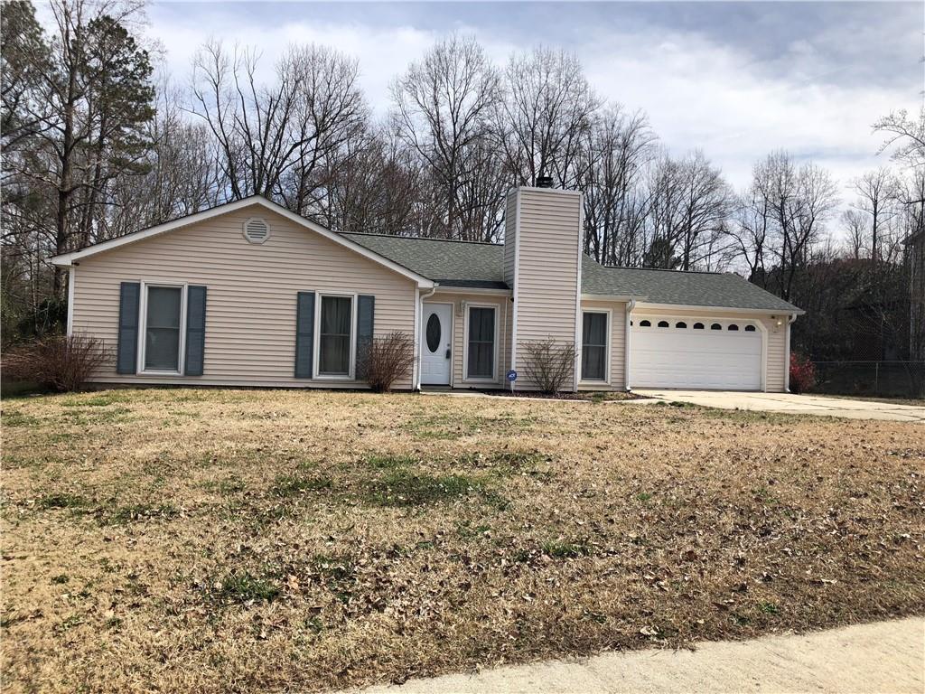 Cute low maintenance stepless ranch with Vinyl siding, tile floors, and newer roof. Interior has been freshly painted. Master with double vanity and large walk in closet. Updated secondary bathroom. Private large fenced back yard with large storage building with electricity. Near expressway and downtown Braselton.