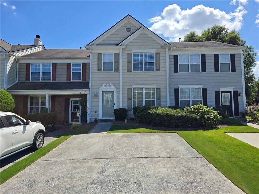 Don't miss out on this well maintained 2 bed 2.5 bath Townhome located in Kennesaw. The property features an updated kitchen with stainless steel appliances, white cabinets, granite countertops and view of the family room. Spacious family room with gas fireplace. Both spacious bedrooms are located upstairs and feature ensuite bathrooms. Laundry closet conveniently located upstairs as well. Manicured, private backyard with a new updated patio. Spacious parking pad. Conveniently located to tons of shopping and dining options. Water and landscaping are included in rent! No pets. Renter's Insurance is required.