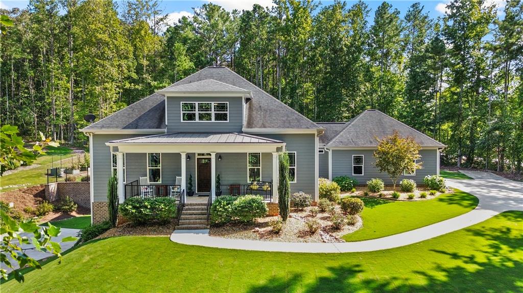 Elegant and Truly Immaculate! 2017 Built Craftsman Style Home on 4 Acres. Five Bedrooms, 3.5 Baths with Master on Main AND Full Finished Basement including Teen/In-Law Suite with Separate Driveway and Garage. The Long Driveway, Abundance of Privacy & Covered Rocking Chair Front Porch welcome you. Beautiful Hardwood Floors throughout Main Level. Gorgeous Kitchen featuring Granite Counters, Stainless Appliances & Tile Backsplash. A Large Center Island, Vent Hood & Pendant Lighting complete this Wonderful Entertaining Space. Open Concept Family Room Boasts Great Natural Light & Built-in Surround Sound that extends to Back Porch. Generous Primary Suite on Main Level with Large Walk-in Closet that includes Custom Closet System. Master Bath has Split Vanities, Oversized Tile Shower with Frameless Glass & Separate Water Closet. There is a Second Private Bedroom or Home Office on First Floor. Upstairs has HUGE Loft Area for Recreation, Gaming, etc. In addition, there are 2 More Bedrooms and a Full Bath. Upstairs also has Another Flex Room Perfect for Craft/Storage Room. The Custom Finished Basement will be the envy of all your friends. It has Amazing Natural Light and features a Full Kitchen with White Cabinets, Peninsula Island & Granite Counters. There is also a Family Room, Private Bedroom & an Updated Full Bath with Walk-in Shower. This Space includes a Private Driveway and Oversized Garage for Maximum Privacy. The Garage is Air Conditioned and has Ample Space for Gym, Workshop, etc. The Covered Back Porch walks out to a Fenced Backyard Oasis. This Space has an Amazing Pool with Walk-in Steps, Sitting Area and Diving Board. Flat Yard with Room to Play for Kids/Pets. You can warm up on Cool Fall Evenings by the Firepit or in the Hot Tub next to the Pool. 2017 Roof, HVACs & Water Heater. Hardwired High Speed Internet. 3 Car Garage with Insulated Doors. Extended Parking Area for an RV, Boat or Both. Just Minutes to Downtown Carrollton, Shopping, Dining, etc. This is TRULY a Must See!