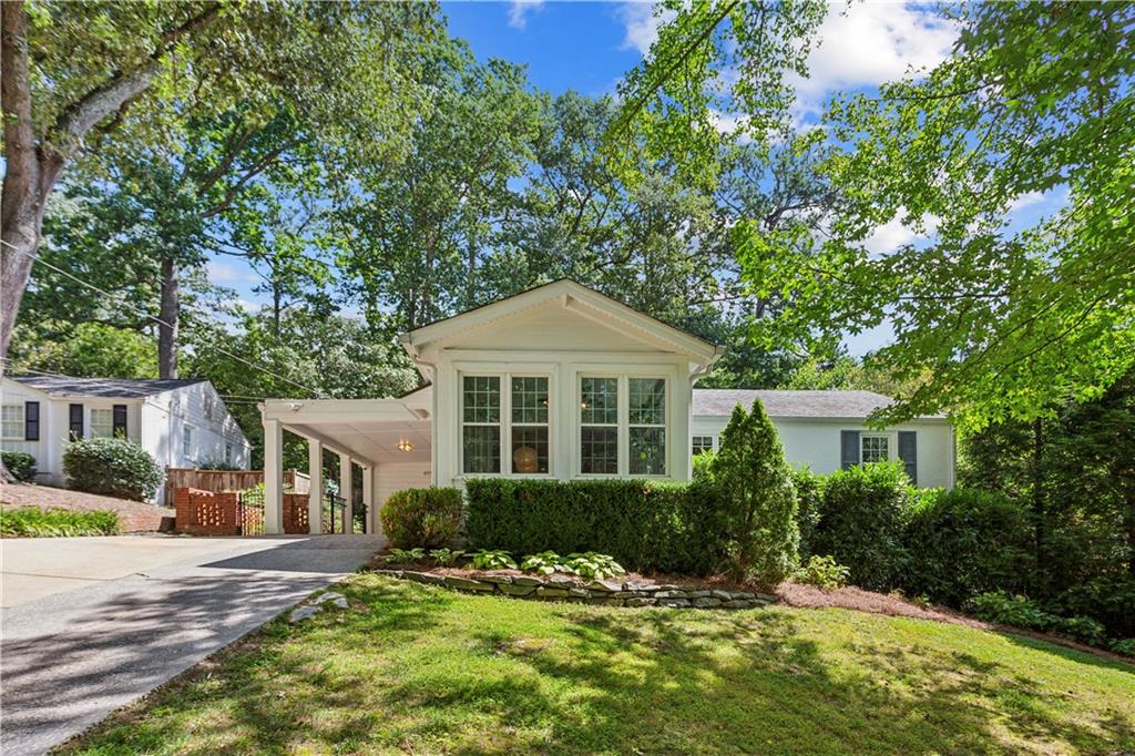 Welcome home to this beautifully updated 4-bedroom, 3-bath bungalow in the highly sought-after Morris Brandon Elementary district! This charming home blends timeless style with modern convenience, featuring a fully renovated kitchen with freshly painted cream cabinets, quartz countertops, Ciot tile backsplash, double ovens, and brass hardware. The spacious owner’s suite includes a large walk-in closet, dual vanities, and a separate sitting room or office nook—perfect for working from home or a tranquil retreat. Enjoy natural light throughout, designer lighting and fans, a stunning Roman plaster fireplace with reclaimed wood mantel, and renovated bathrooms with upscale finishes. The walk-out backyard is ideal for entertaining, complete with a stone patio, new landscaping, raised planters, swingset, playhouse, and outdoor lighting. Additional highlights include new HVAC (2023), whole-house water filtration, updated CPI security system, new gutters and generous storage with a stand-up crawlspace and large attic. This quiet and charming neighborhood is within walking distance of Channing Valley's lovely playground and minutes from the Northside Beltline and all of the best entertaining and dining in the city. Thoughtfully appointed and truly move-in ready—this is the one you’ve been waiting for!
