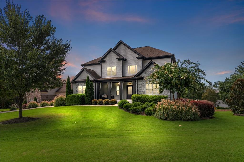 This stunning East Cobb home blends modern updates with everyday comfort, all in a quiet neighborhood with no HOA! From the moment you arrive, the brand new double front doors, professional landscaping, and fresh paint inside and out create a warm welcome. Step inside to a soaring two-story foyer, a fireside living room, and a beautifully remodeled kitchen that flows into the breakfast area. The main level also offers a guest suite, half bath, and walk-out deck for seamless indoor-outdoor living. Upstairs, the oversized primary suite boasts custom his-and-hers closets and a fully remodeled spa bath, while three additional bedrooms, two full baths, a flex room, and laundry room add convenience. The 1,640 sq. ft. unfinished basement offers endless possibilities for expansion, and the garage is ready for the future with a 220V Level 2 EV charger outlet. Set on nearly half an acre, this move-in ready home combines space, style, and thoughtful upgrades in one incredible package.