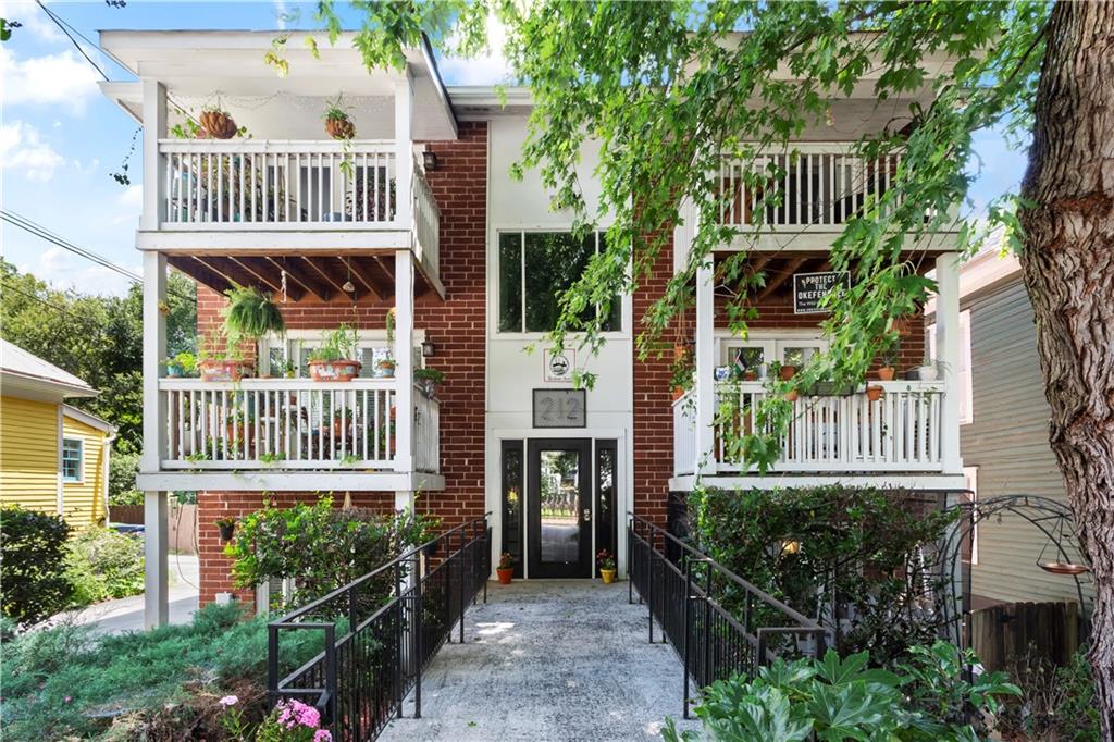 Upgraded and effortlessly accessible! This beautifully updated walk-out unit in one of Cabbagetown’s most cherished boutique buildings offers all the style of intown living—plus the rare perk of private exterior access. It lives like a house, without the maintenance! Step inside to find gleaming hardwood floors and a bright, airy layout that lives large. The renovated kitchen is a true standout, featuring ceiling-height cabinetry, stainless steel appliances, a gas range, and upgraded pantry storage—perfect for gathering with friends or enjoying a quiet night in. Designed with the classic Cabbagetown “shotgun” layout, both bedrooms are tucked away from the main living space for added privacy. Thoughtful details continue with custom closet systems and a recently renovated bathroom featuring beautiful tilework, an updated vanity, and an illuminated mirror. Enjoy peace of mind with a new HVAC system (2024). Additional perks include assigned parking, a dedicated storage unit, and a welcoming community that makes this building feel like home. Beyond the walls, this home offers more than just a great location—it’s a place to belong. Cabbagetown is known for its neighborly spirit, colorful murals, and walkable charm. You're just steps from Carroll Street, Cabbagetown Park, and beloved local events like Chomp and Stomp.