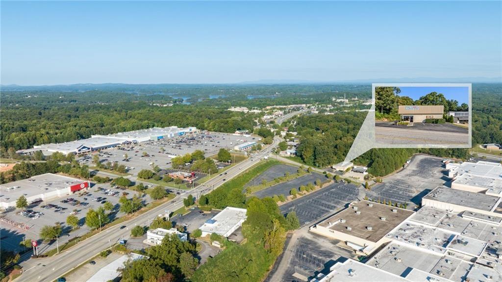 For sale or Lease. Prime location in the heart of the city! This unique commercial property is adjacent to Lakeshore Mall and across the street from Walmart and Lowe's. With the future redevelopment plans of Lakeshore Mall and Gainesville's west side, this property will be a great investment! Call today for your personal tour!